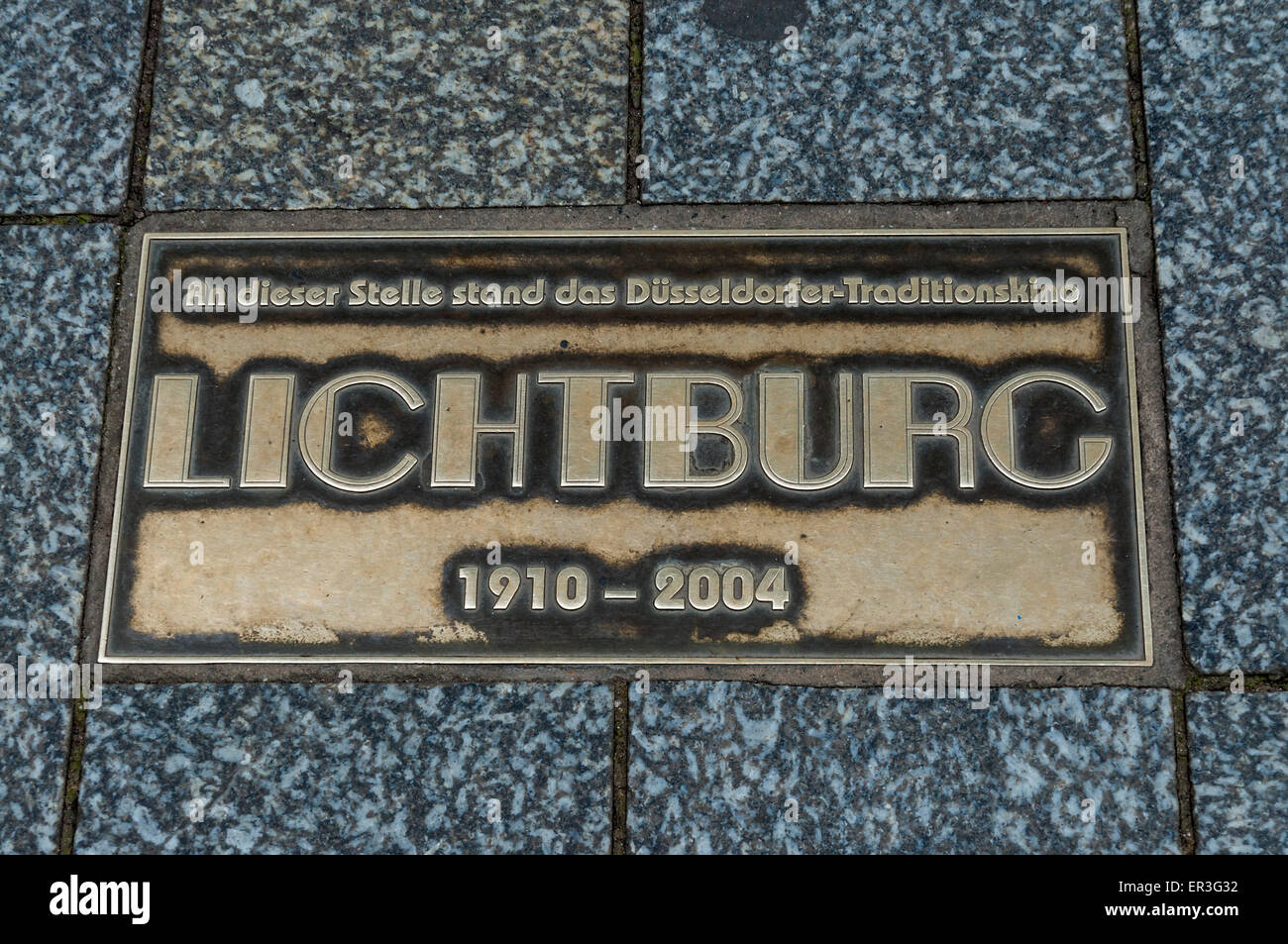 Brass plaque commemorating the Lichtburg, a popular cinema on the Königsallee in Düsseldorf, Germany Stock Photo