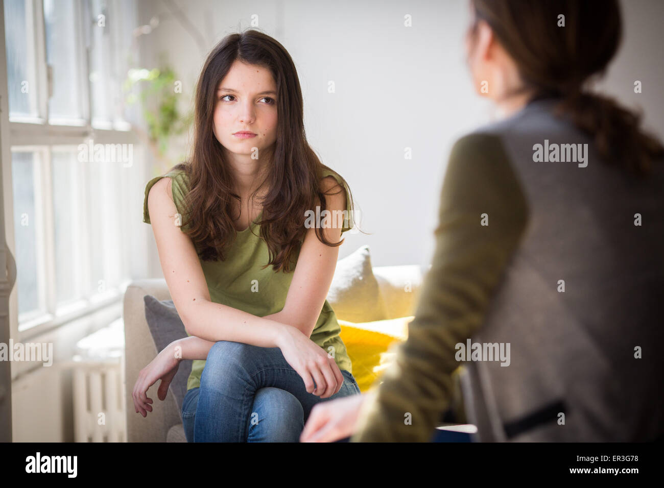 Woman discussing with a teenager. Stock Photo