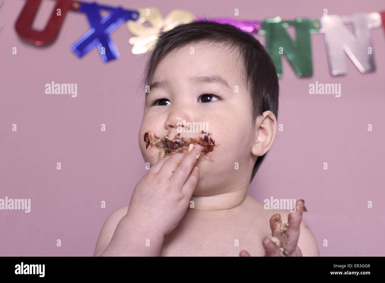 Baby eating birthday cake Stock Photo Alamy