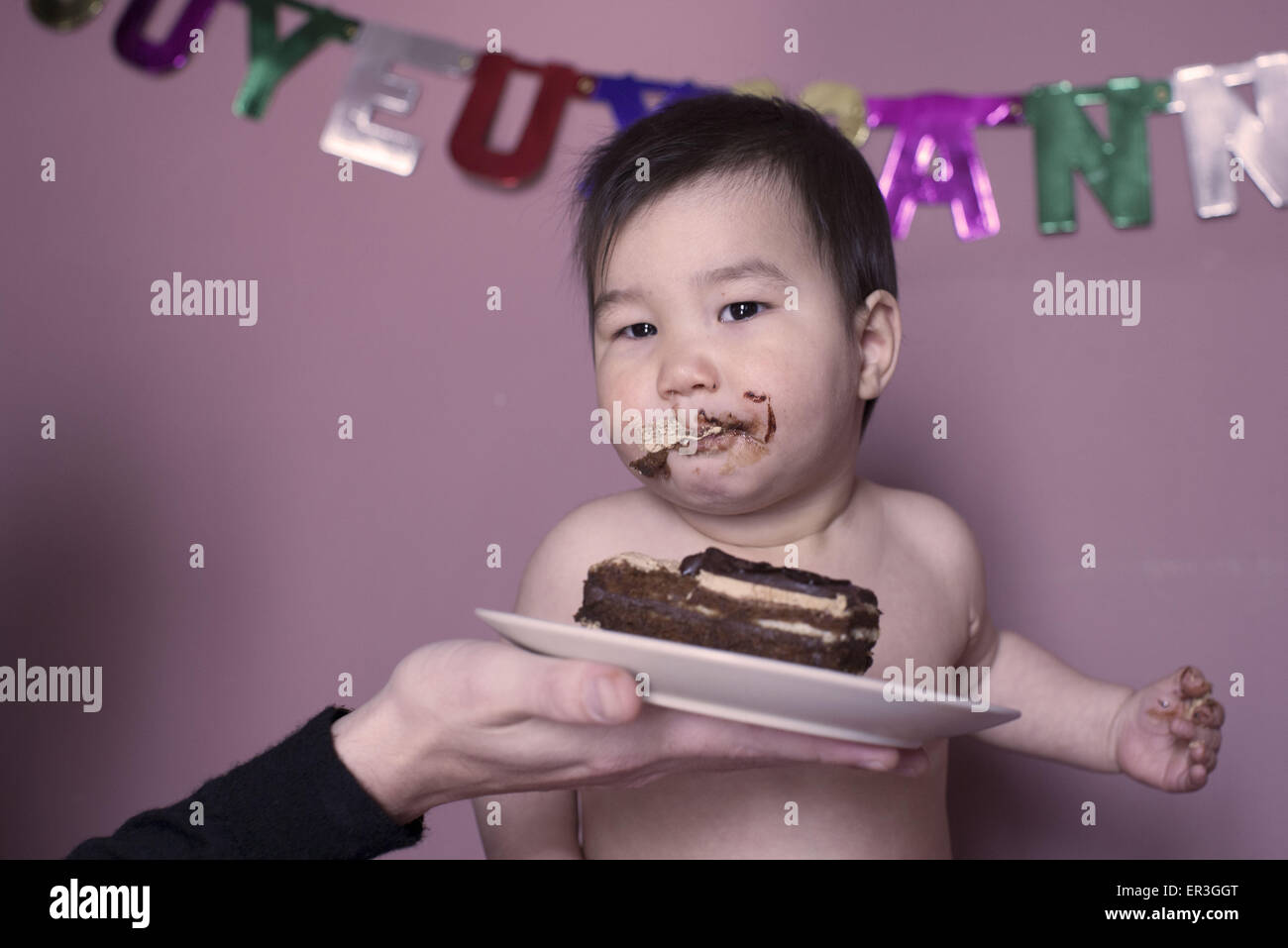 Baby eating birthday cake Stock Photo Alamy