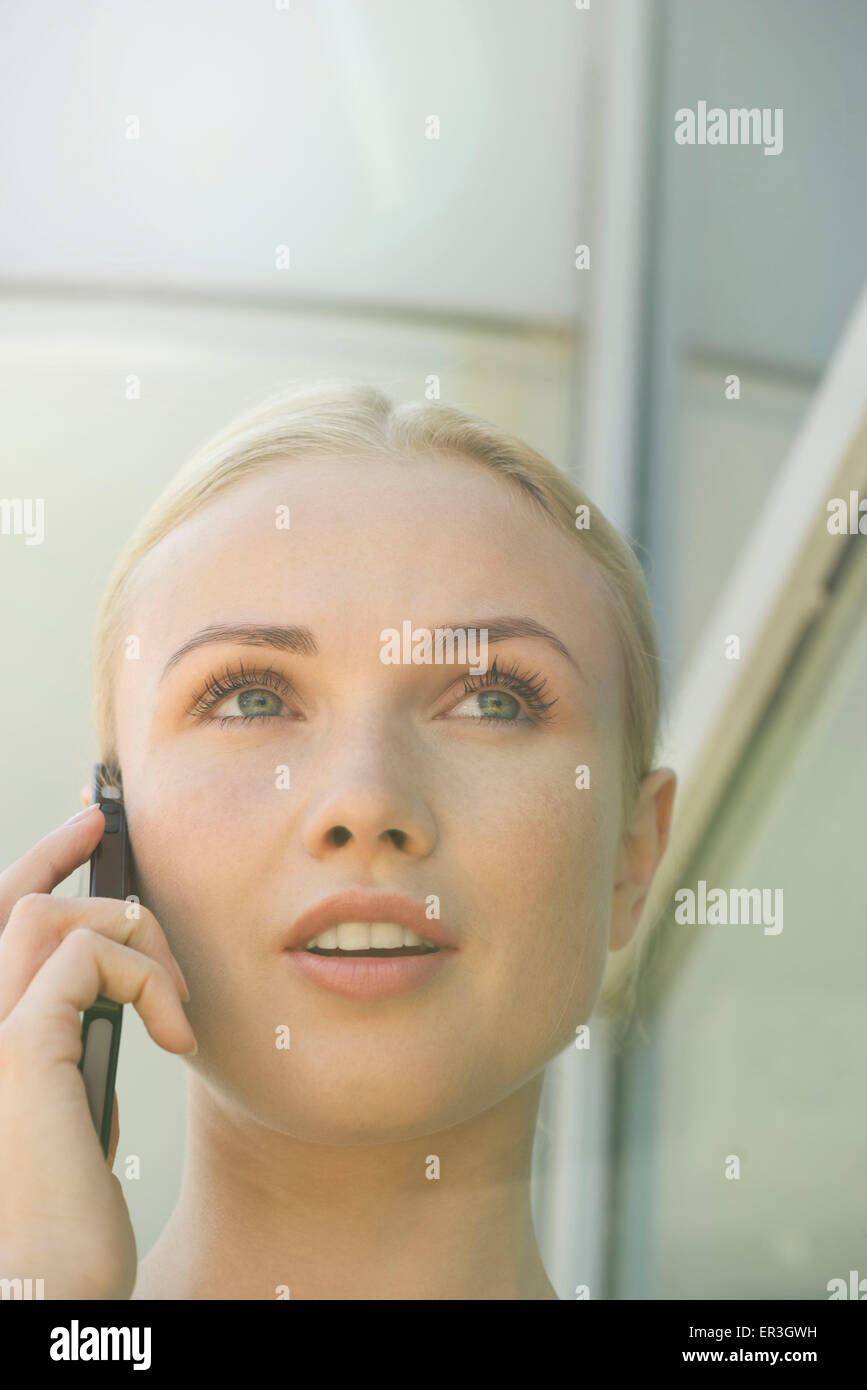 Blonde woman phone back view hi-res stock photography and images - Alamy