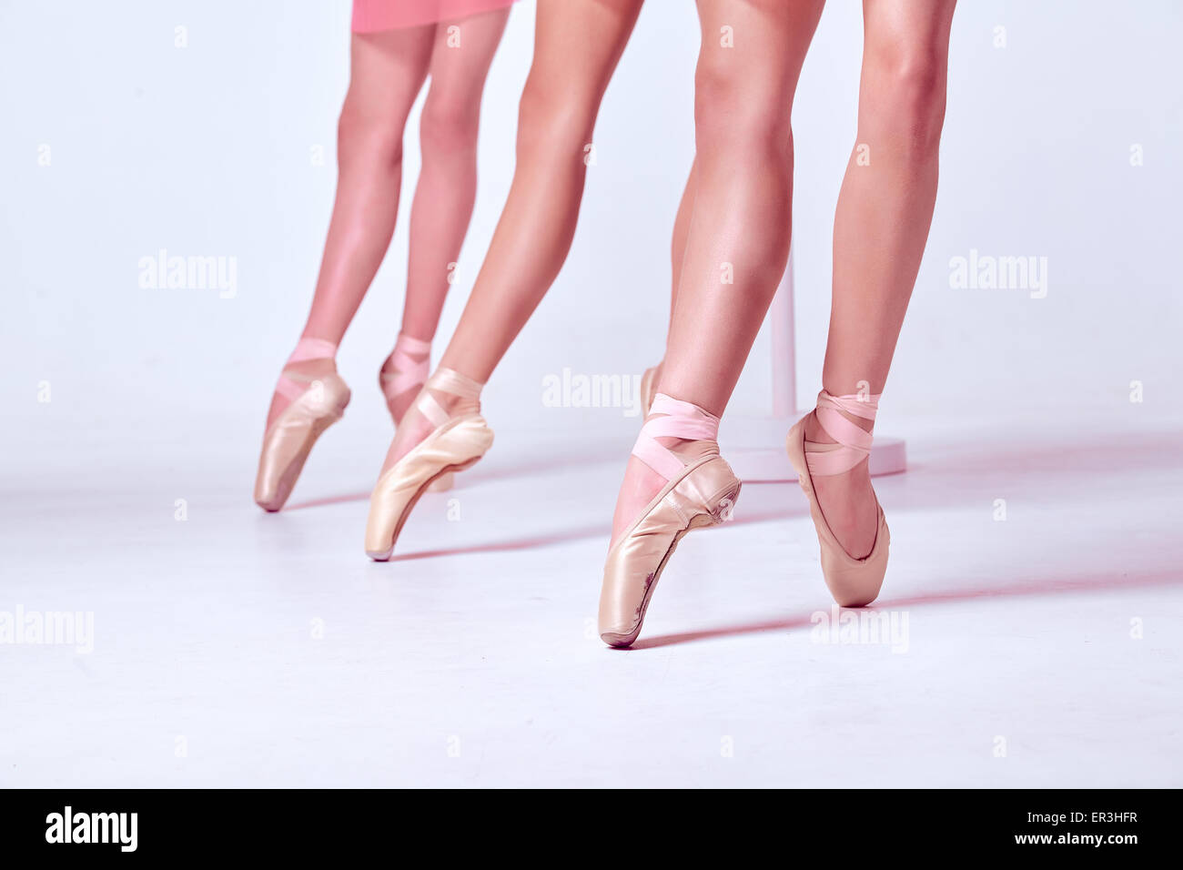 The feet of a young ballerinas in pointe shoes Stock Photo