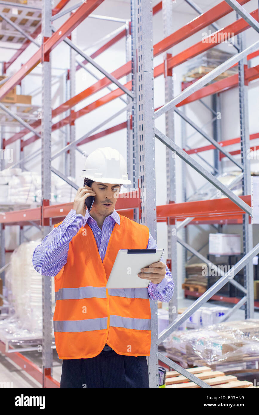 Engineer working in warehouse Stock Photo Alamy