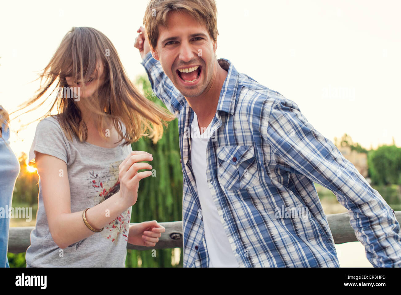 College friends partying outdoors Stock Photo