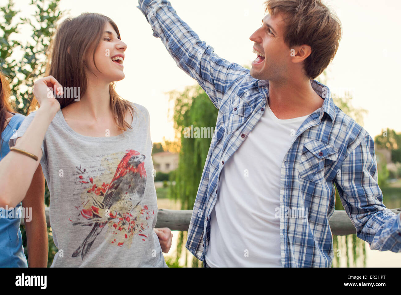 Friends dancing together outdoors Stock Photo