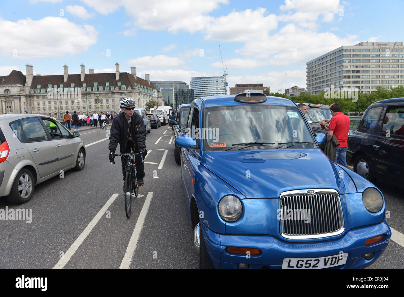 Westminster, London, UK. 26th May 2015. Hundreds of Black cab drivers bring Westminster to a halt in a demonstration by United Cabbies Group (UCG) against TFL and mini cabs. Credit:  Matthew Chattle/Alamy Live News Stock Photo