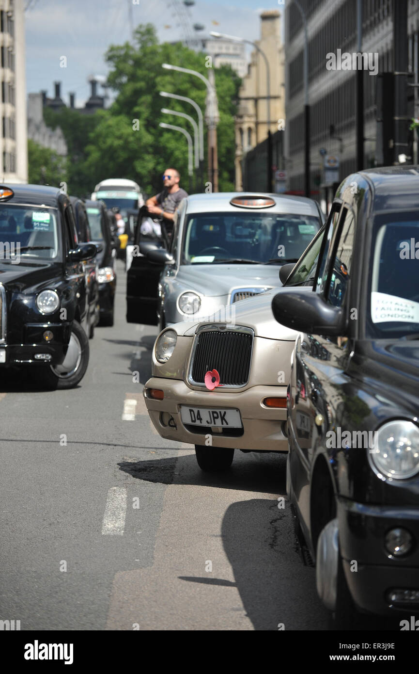 Westminster, London, UK. 26th May 2015. Hundreds of Black cab drivers bring Westminster to a halt in a demonstration by United Cabbies Group (UCG) against TFL and mini cabs. Credit:  Matthew Chattle/Alamy Live News Stock Photo
