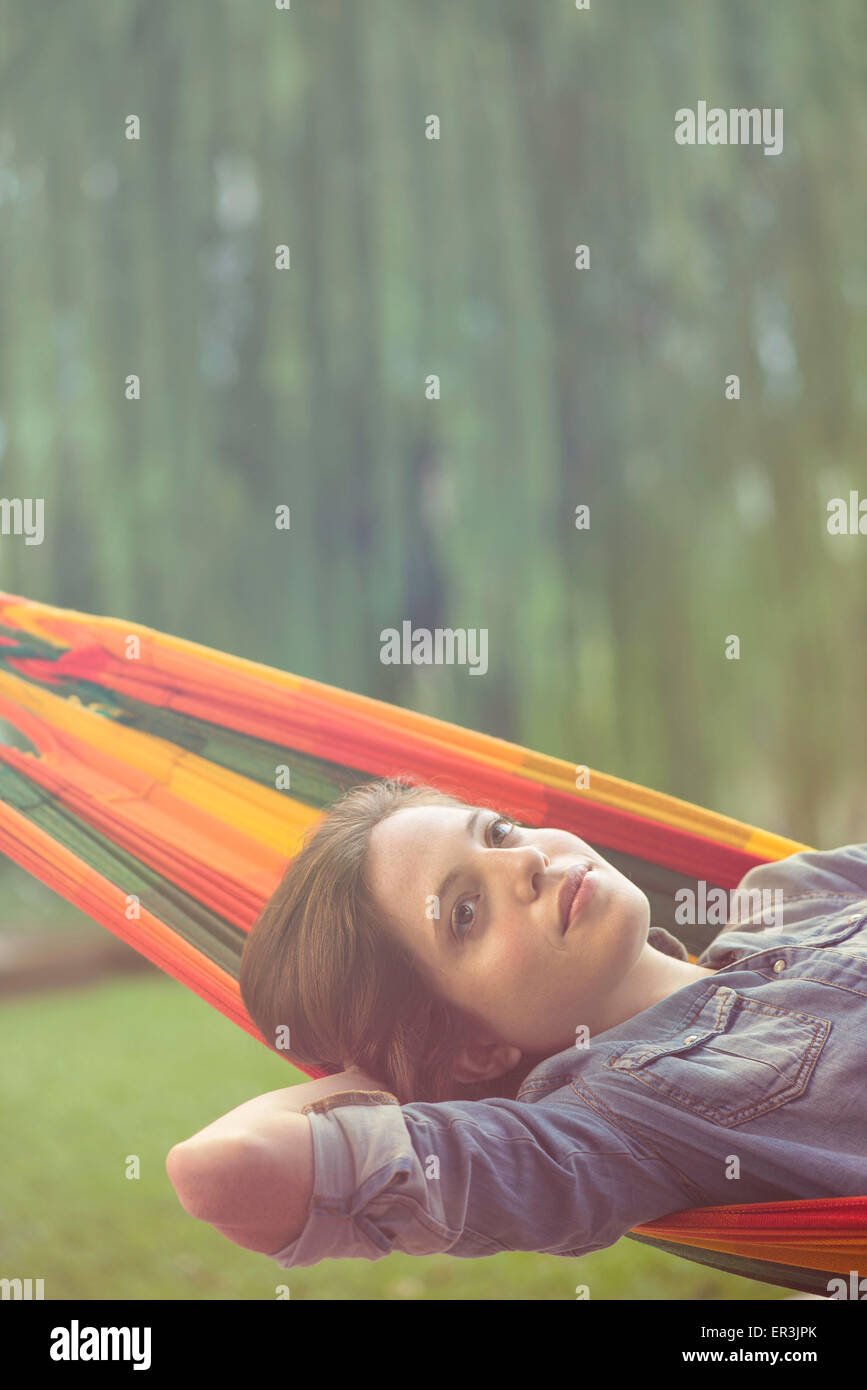 Woman relaxing in hammock Stock Photo