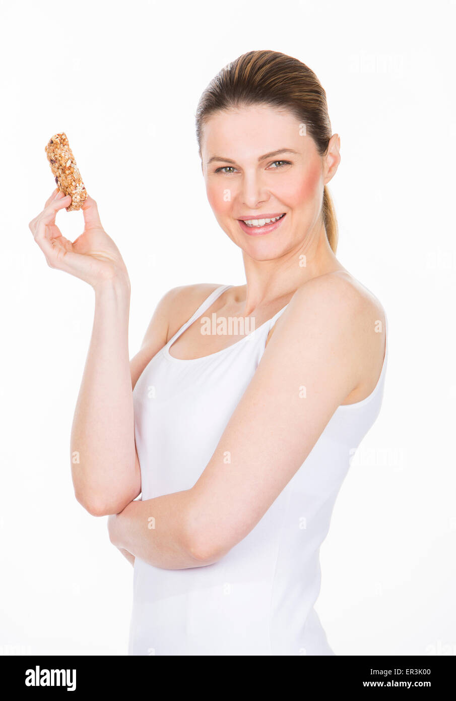 woman with white dress holding a healthy fruit bar Stock Photo
