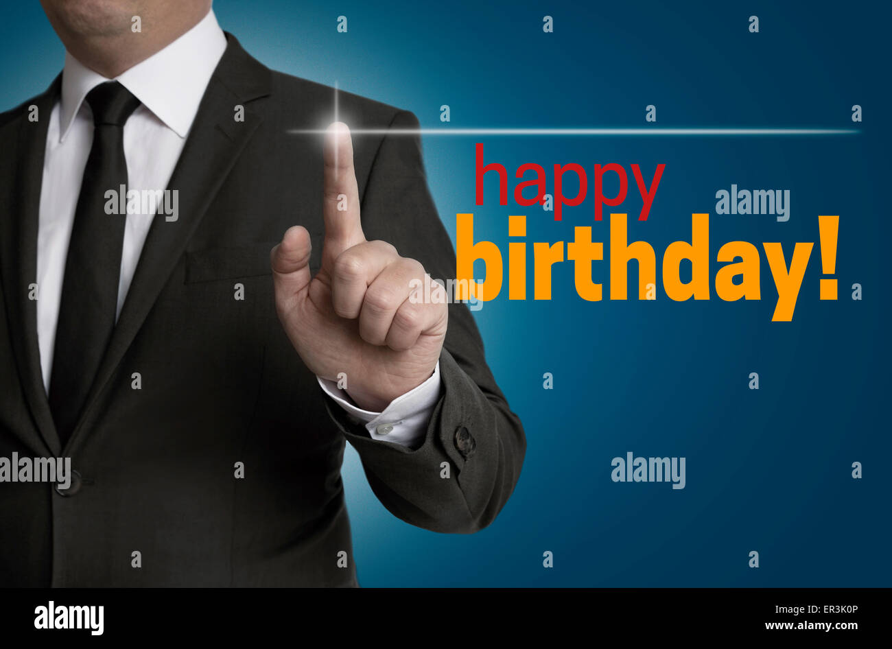 Happy Birthday touchscreen is operated by businessman. Stock Photo