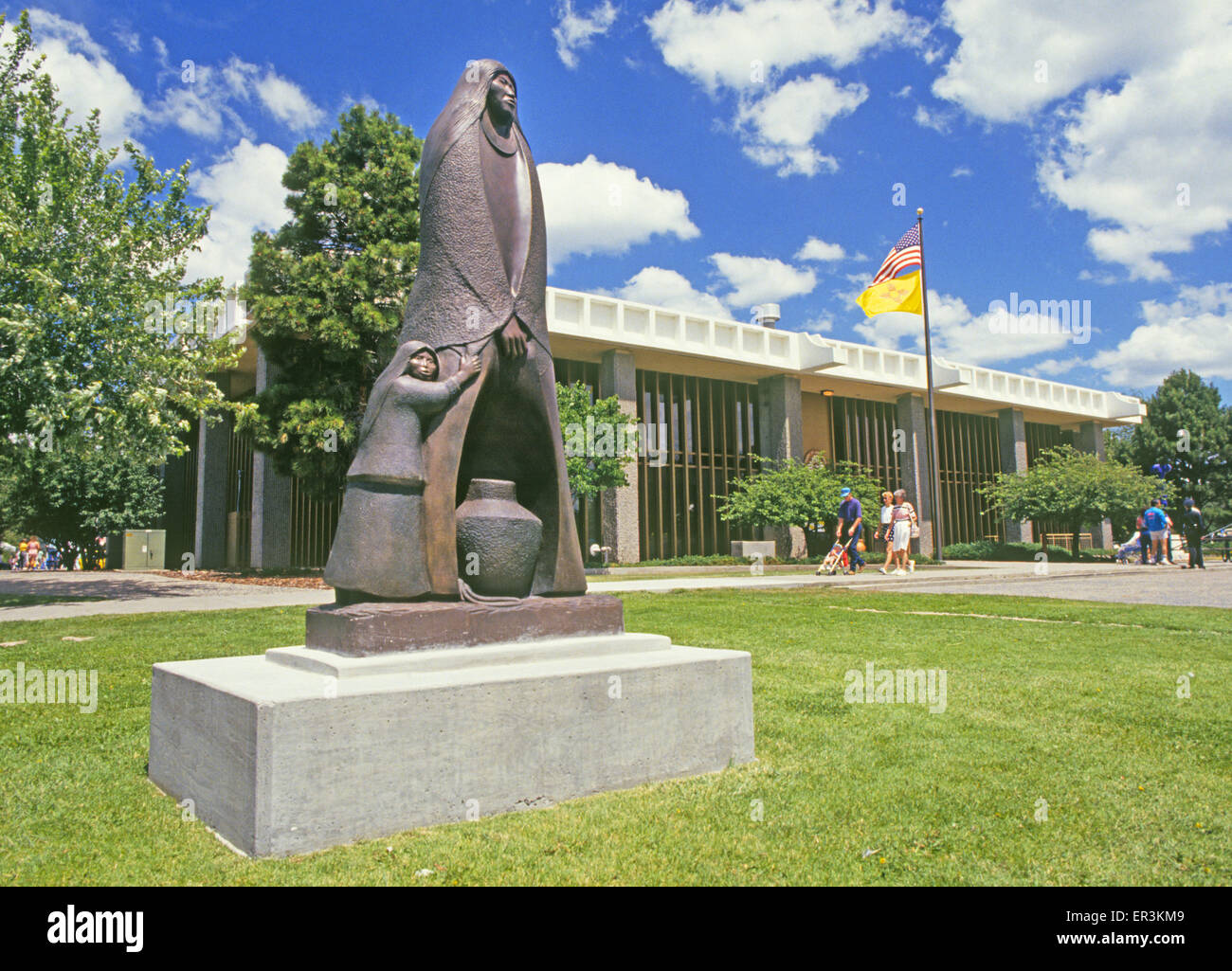 The los Alamos county courthouse and an Indian statue in Los Alamos