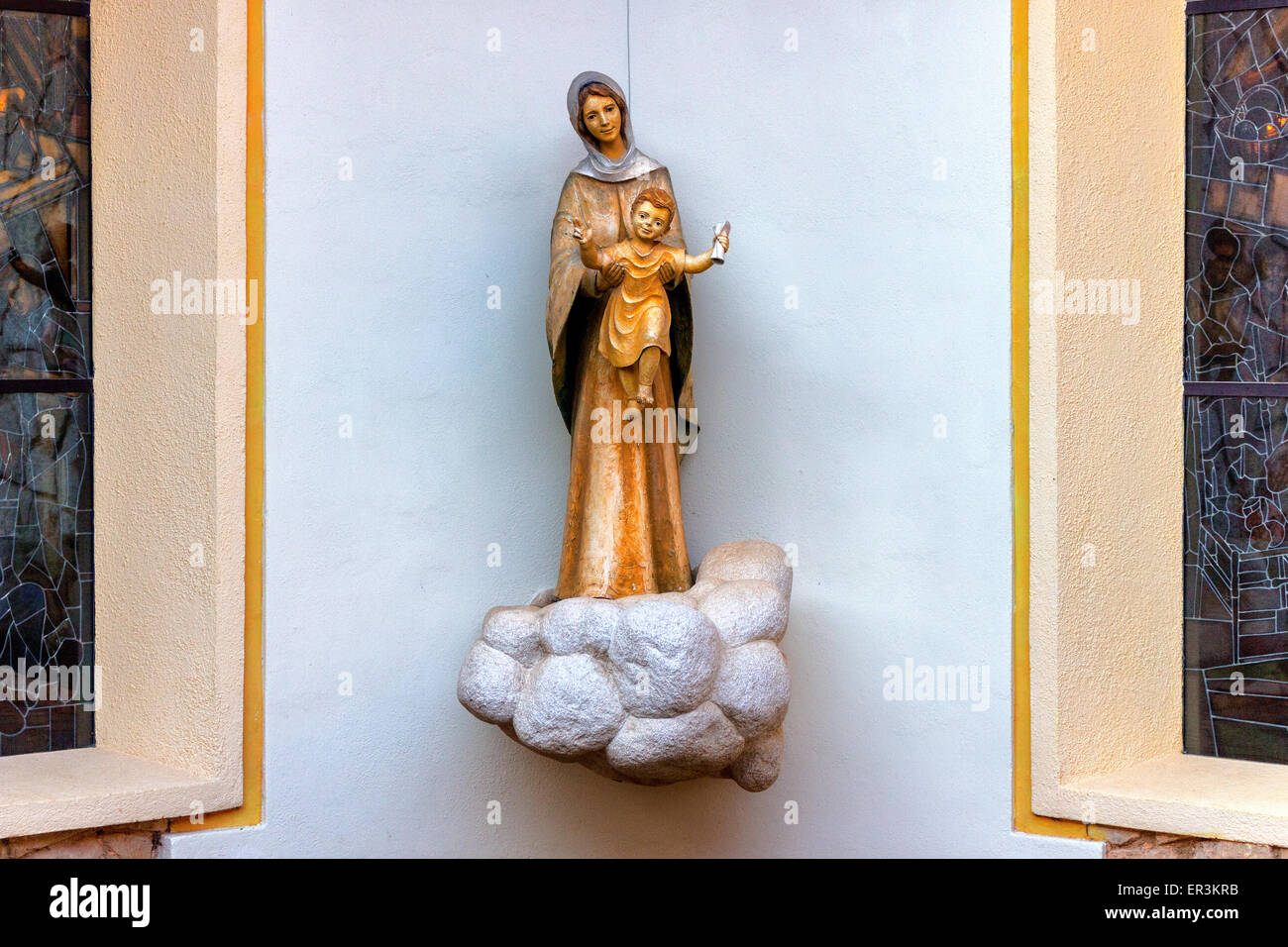 Statue of the Blessed Virgin Mary holding Child Jesus  in a house in  Medjugorje Stock Photo