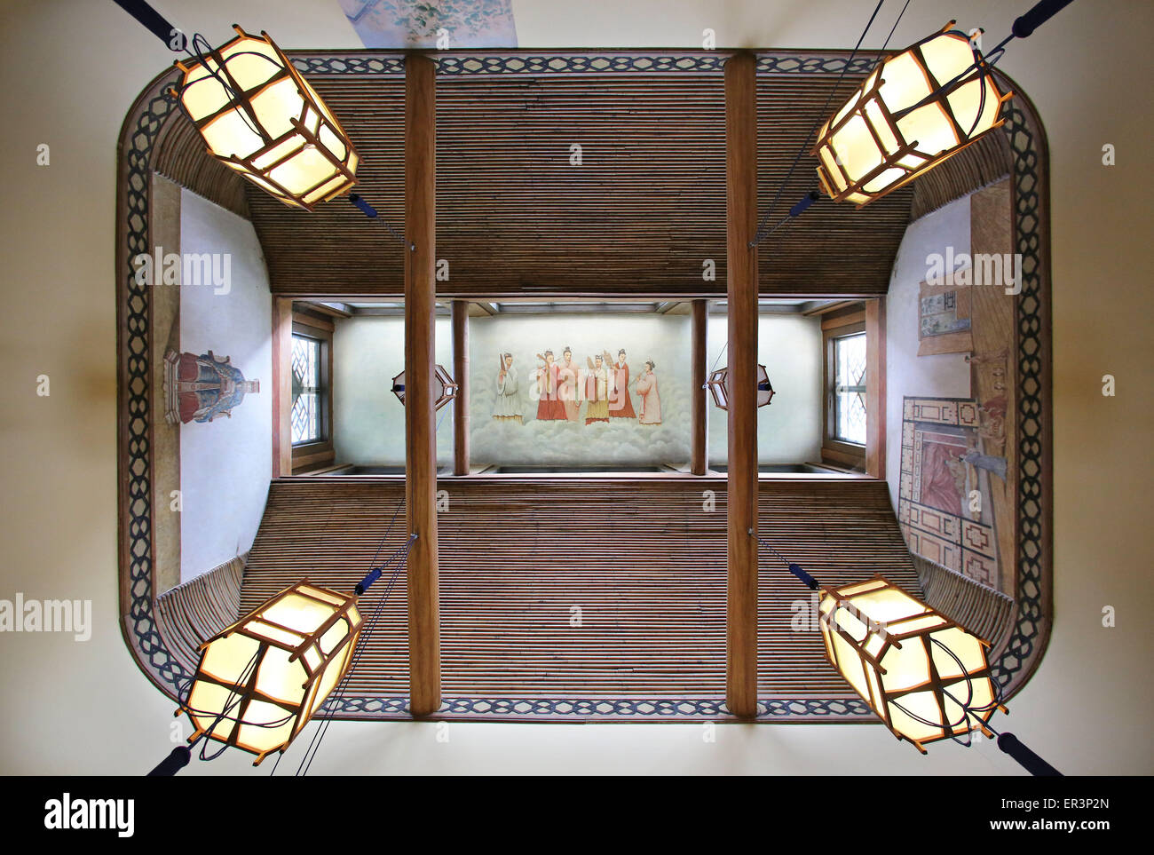 Chinese paper lanterns are mounted to the ceiling of the renovated Chinesisches Haus (lit. Chinese House) located inside the park of Oranienbaum Palace in Oranienbaum, Germany, 26 May 2015. The interior decoration has seen extensive restoration over the last two years. The painted paper wallpapers and the furniture were partially reconstructed. The teahouse built by Franz, Duke of Anhalt-Dessau, in 1795 has undergone extensive refurbishment since 2009 at a total cost of 1.3 million euros and is now open to the public. It is the centrepiece of the only currently still largely preserved English- Stock Photo