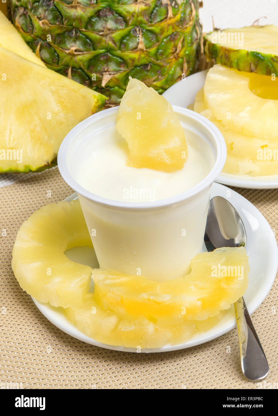 lowfat plain yogurt creamy pineapple flavor Stock Photo Alamy