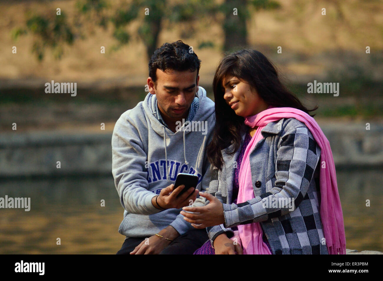 Smart phones camera phones Iphones and Ipads world over have made masses as  photo enthusiasts, young couple taking selfie Stock Photo