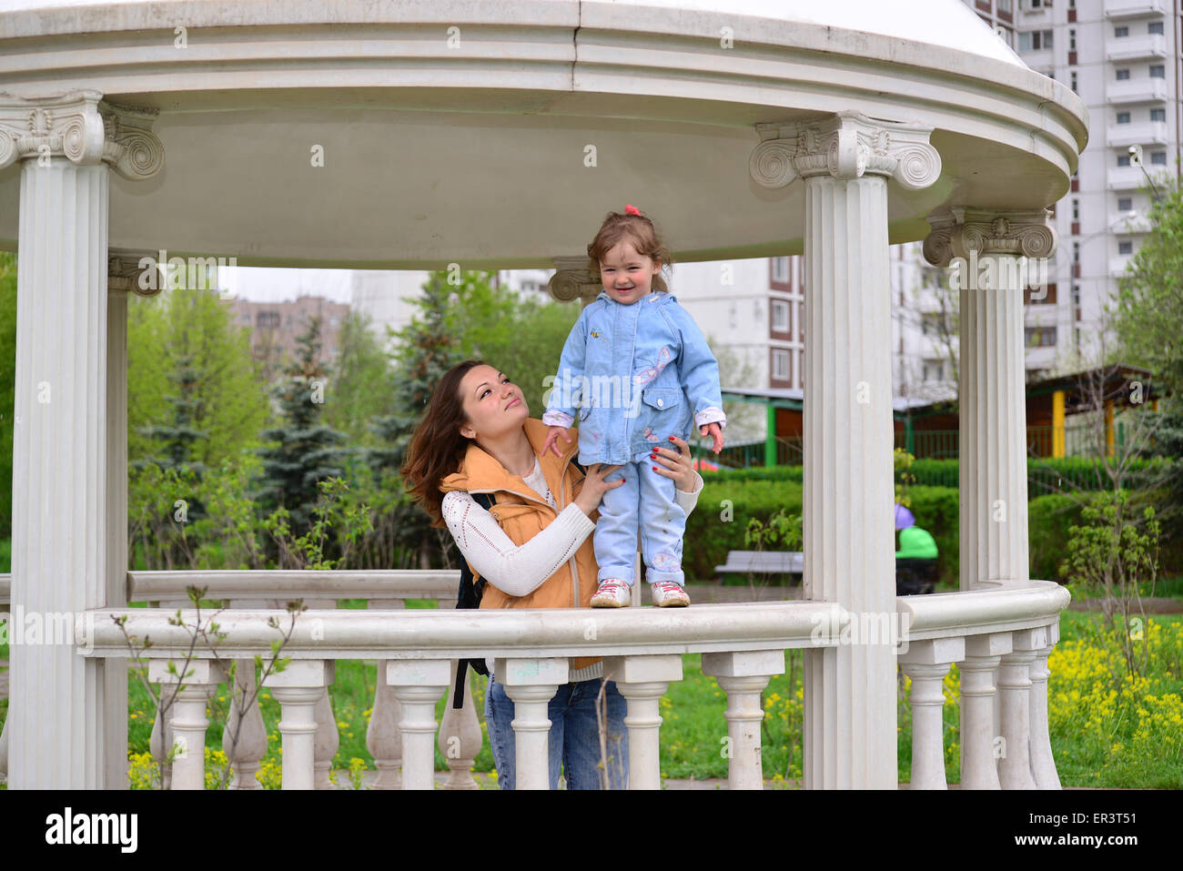 Mom and daughter 2.5 years for a walk in the gazebo Stock Photo