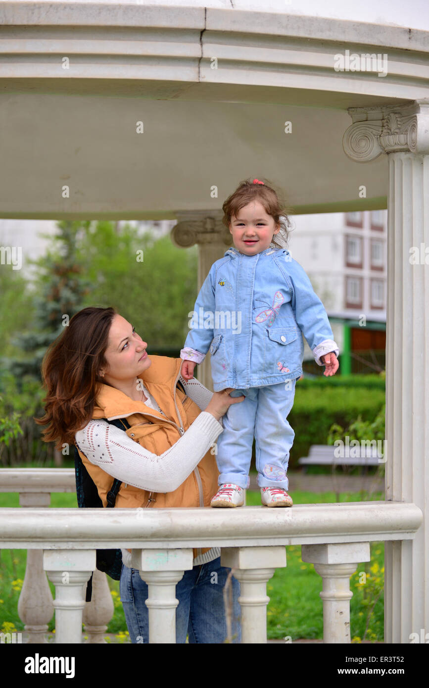 Mom and daughter 2.5 years for a walk in the gazebo Stock Photo