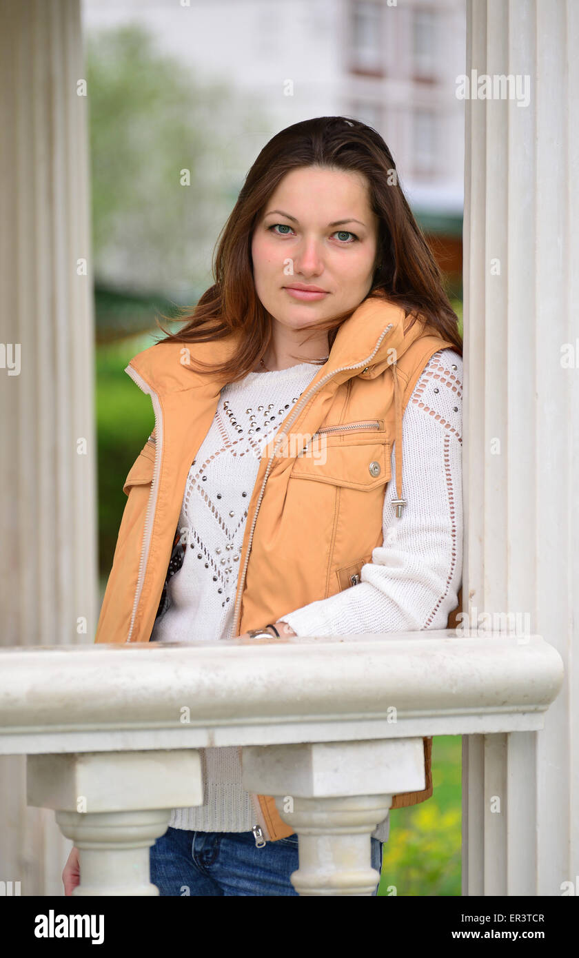 pretty young woman in a gazebo in the park Stock Photo