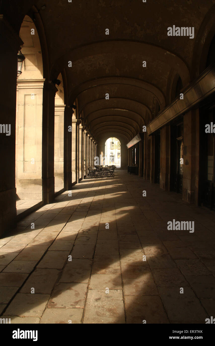 Sun and shade under arches on Passeig d'Isabel II, Barcelona, Catalonia, Spain Stock Photo