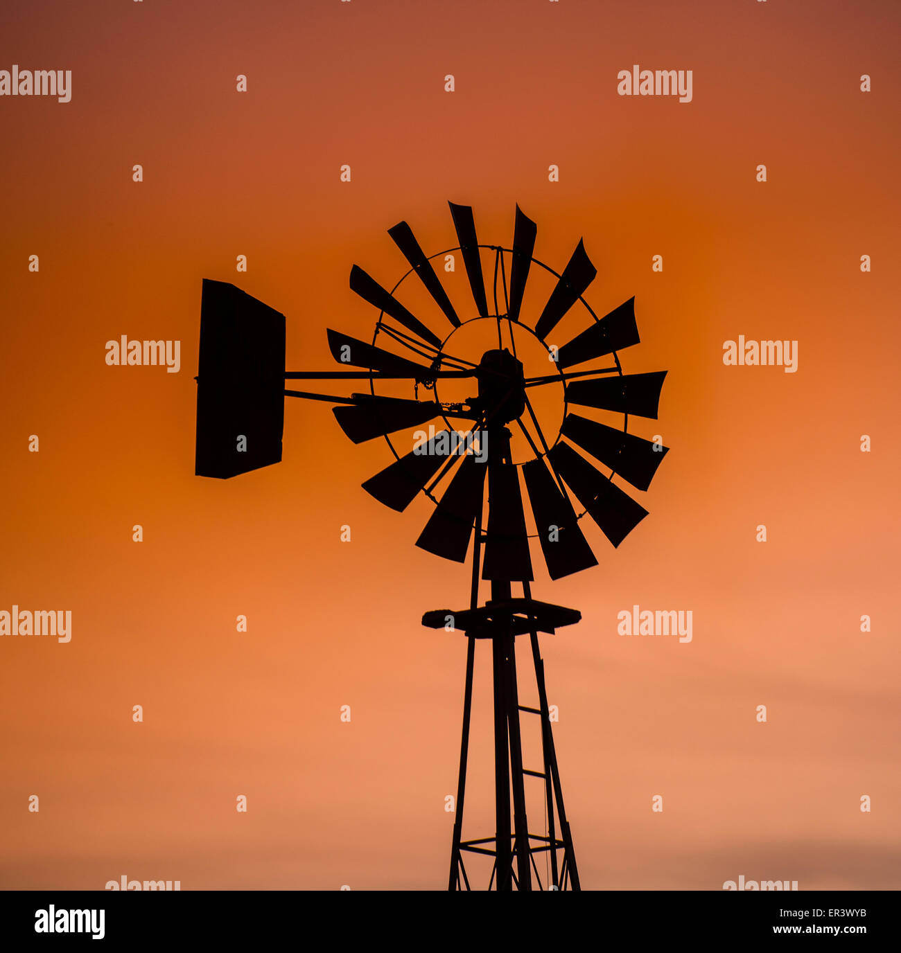 Windmills, Water pump windmill against beautiful sky on Idaho farm. Bose, Idaho Stock Photo