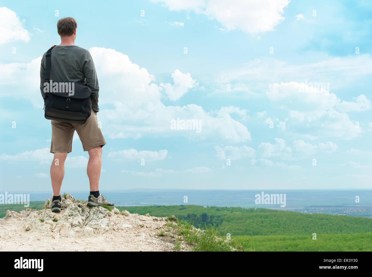 Hiker on top of the hill. Stock Photo