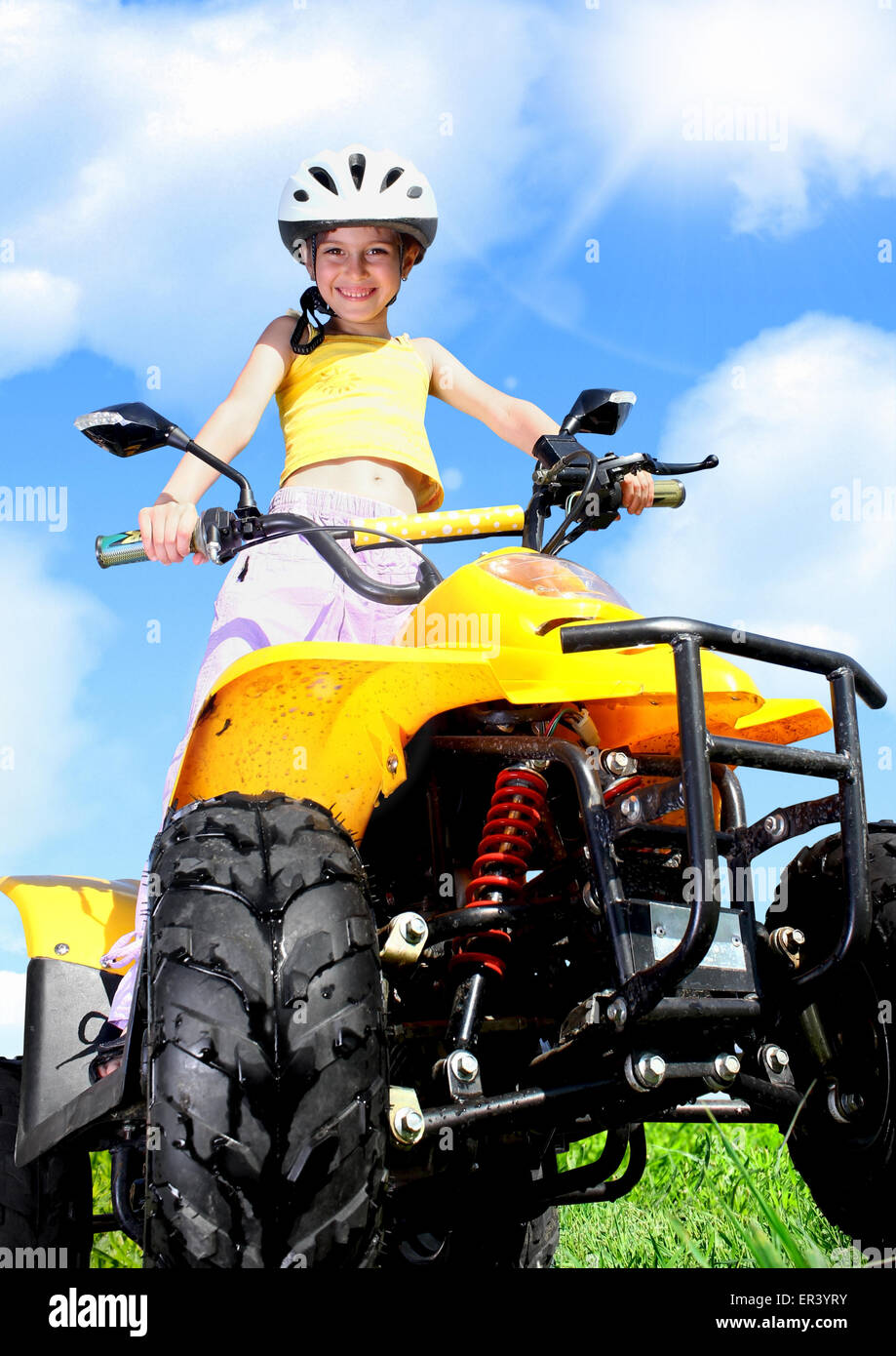 Little Child girl rides on quad Stock Photo