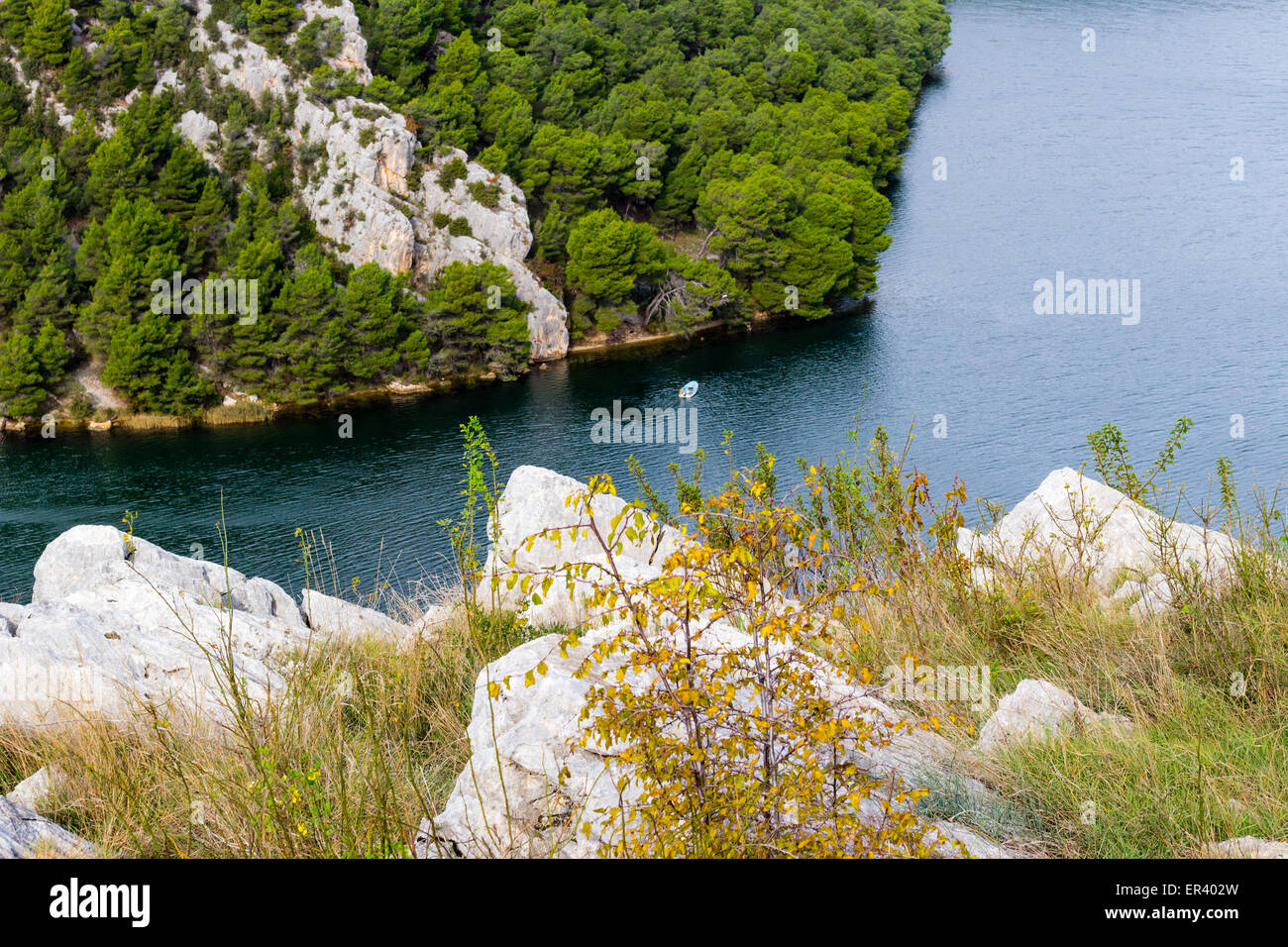View over the bay of Skradin ending Krka river in Croatia: boat in canyon Stock Photo