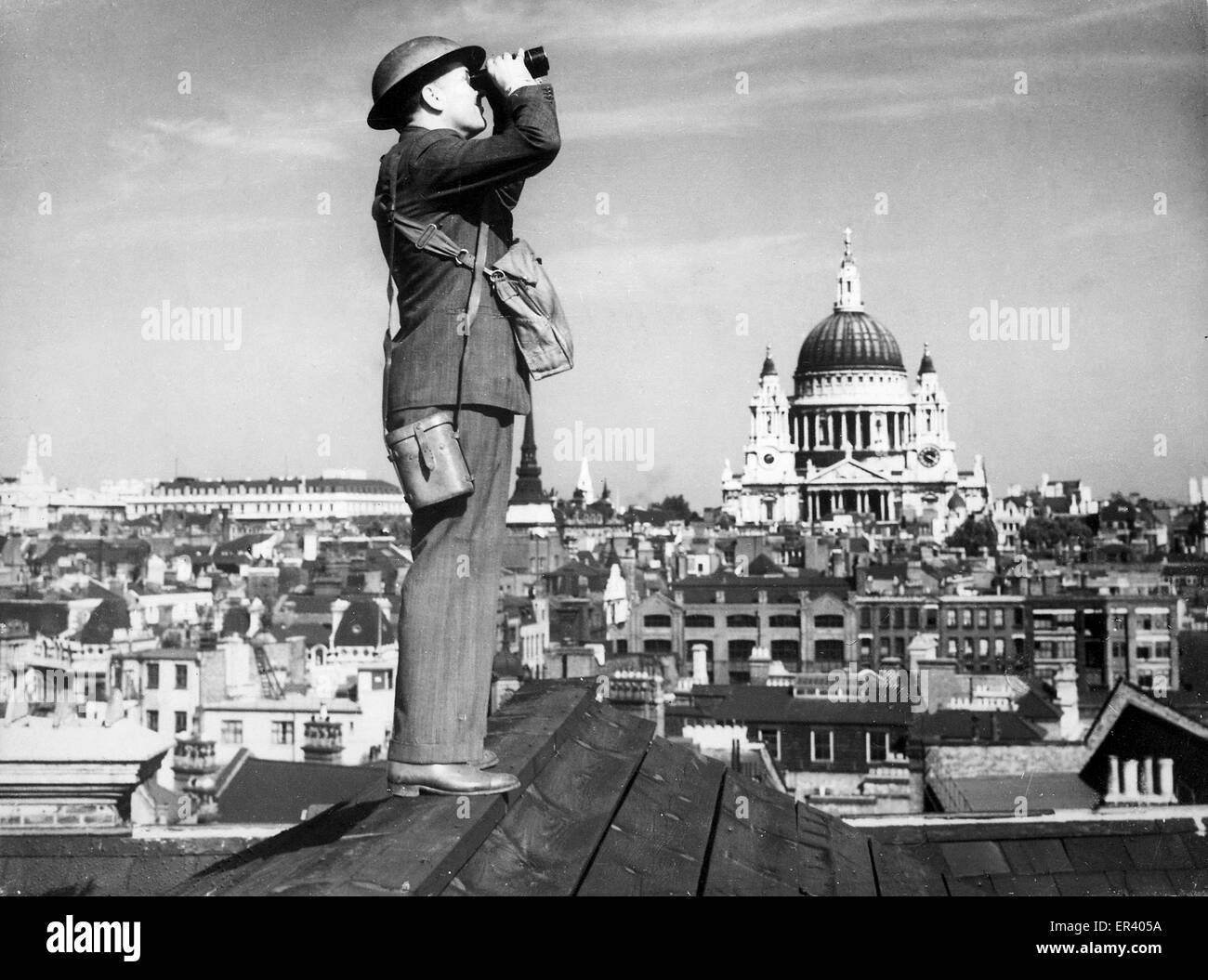 A Royal Observer Corps spotter scans the skies of London. Battle of Britain air observer keeping watch over London Stock Photo
