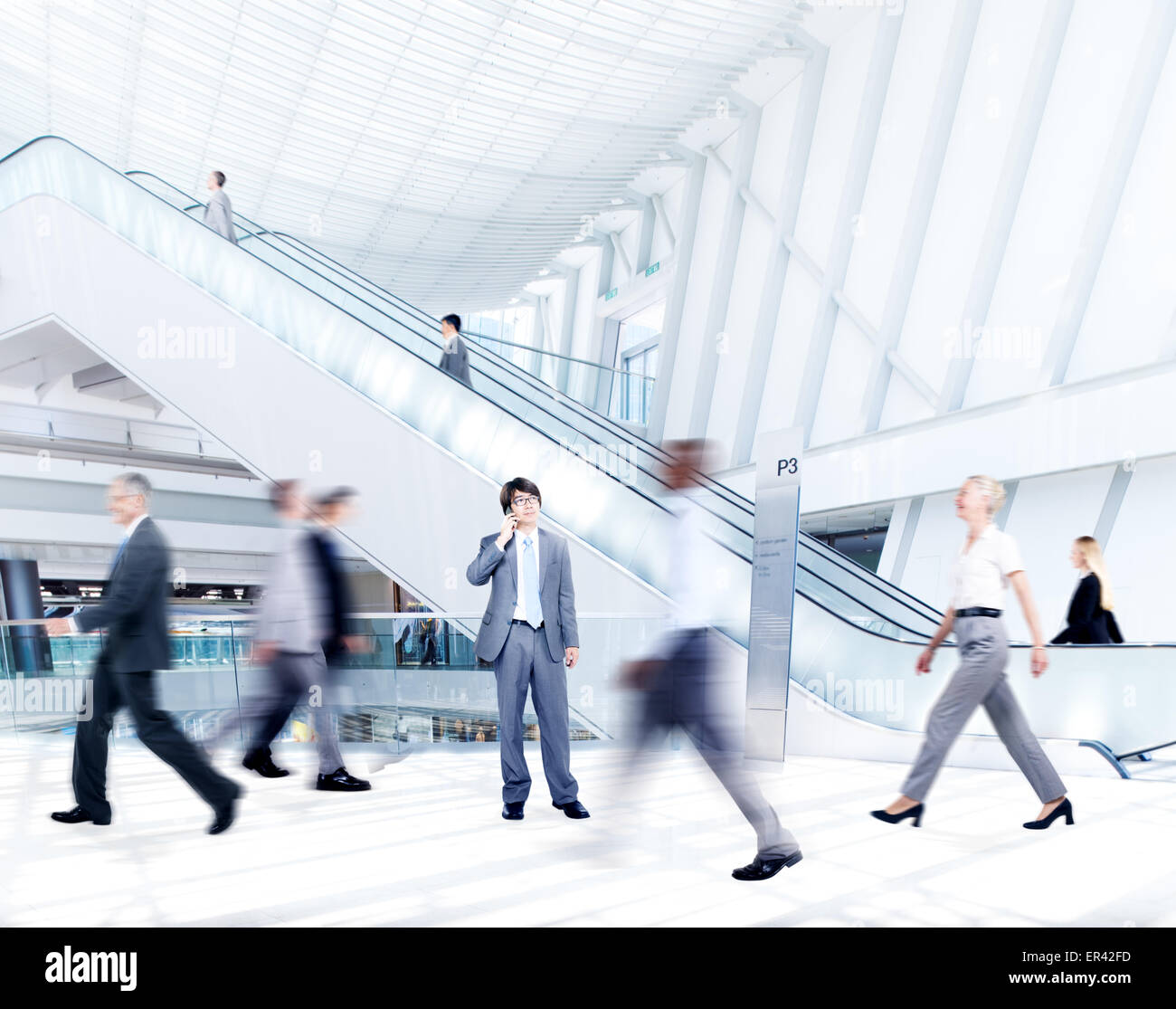 Motion Blurred Business People in the Shopping Mall Stock Photo - Alamy
