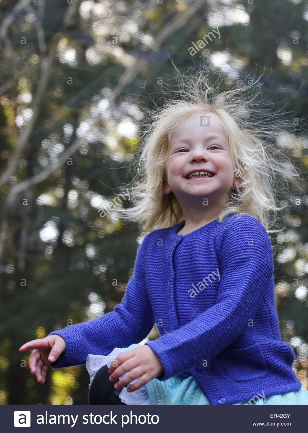A Cute Little Girl With Static Electricity Hair Stock Photo