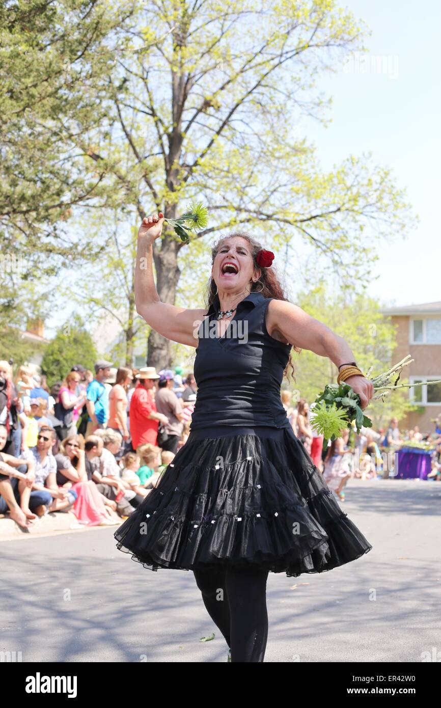 A woman dancing in the May Day parade in Minneapolis, Minnesota Stock