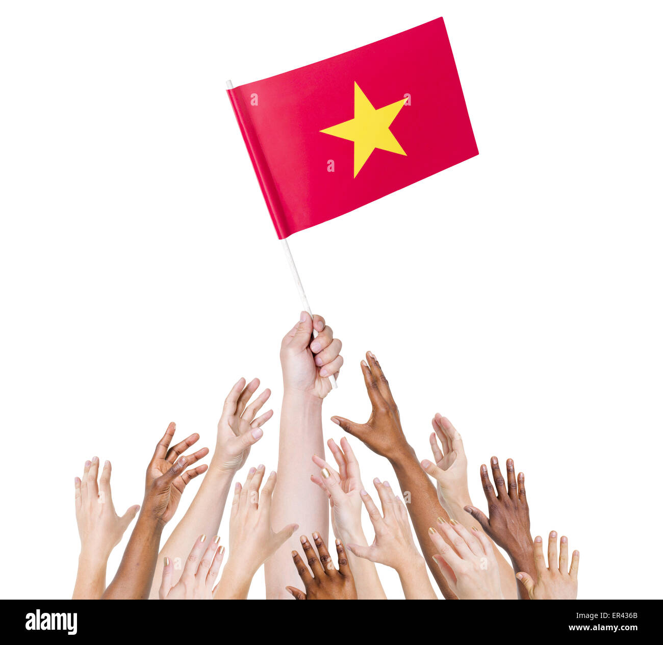 Human hand holding Vietnam flag among multi-ethnic group of people's hand Stock Photo