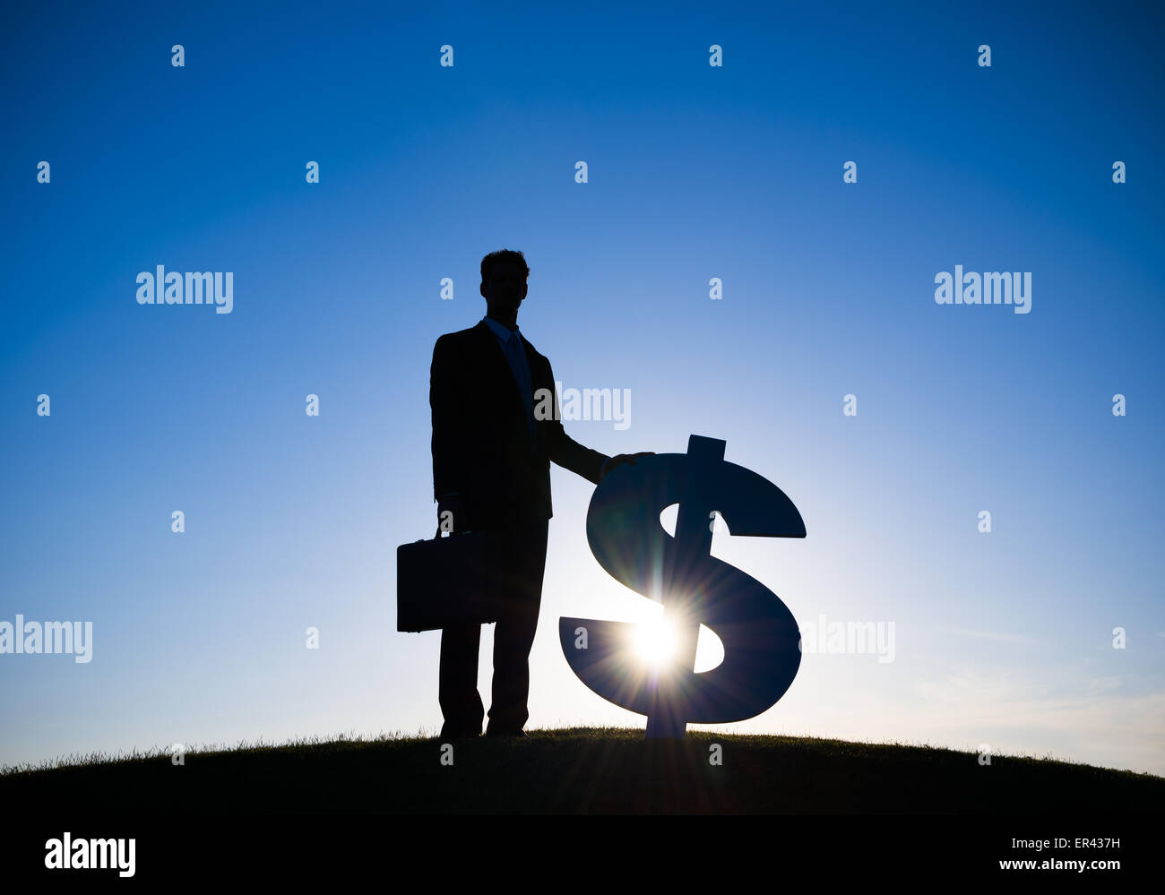 Businessman holding Dollar sign Stock Photo