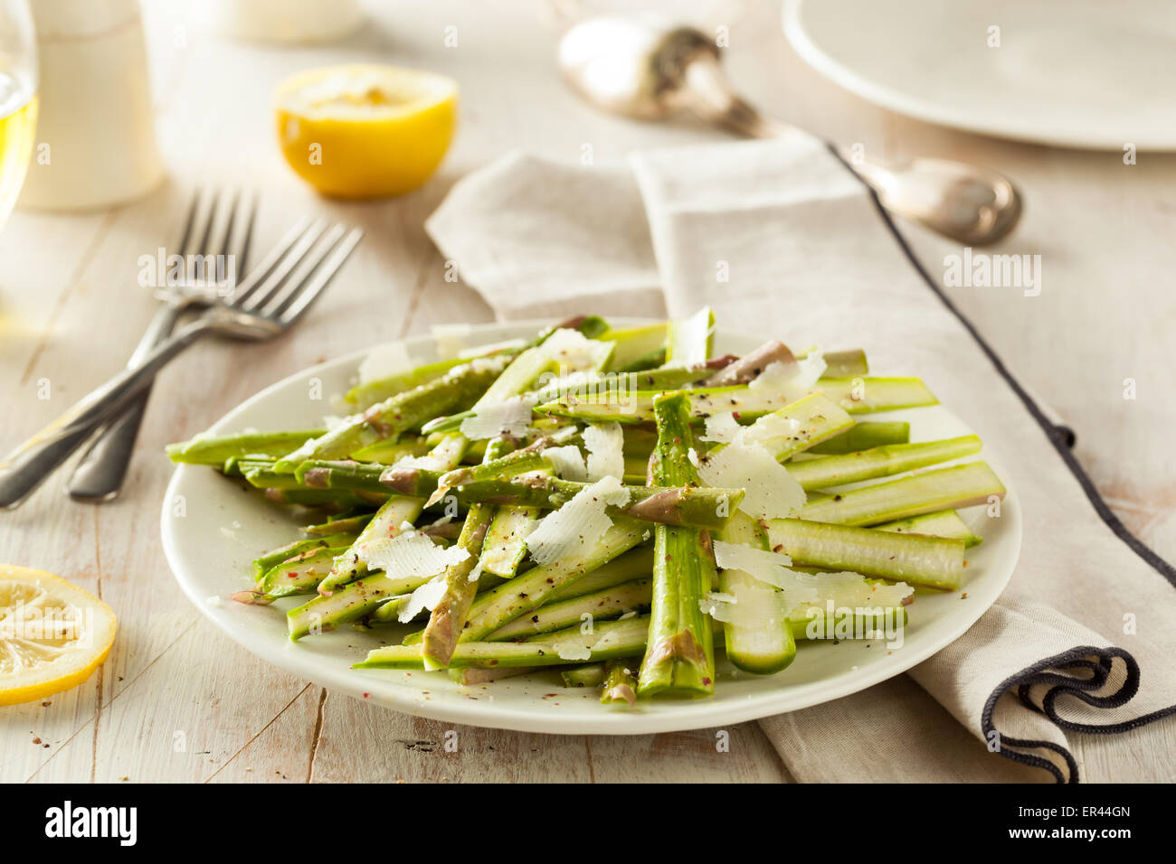Raw Fresh Asparagus Salad with Cheese and Dressing Stock Photo