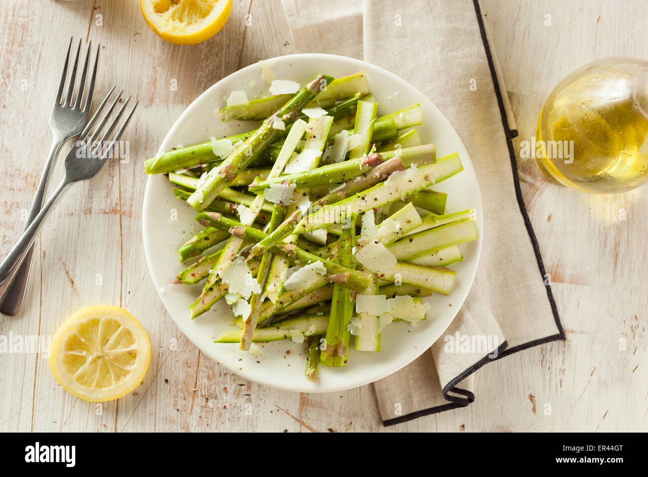 Raw Fresh Asparagus Salad with Cheese and Dressing Stock Photo