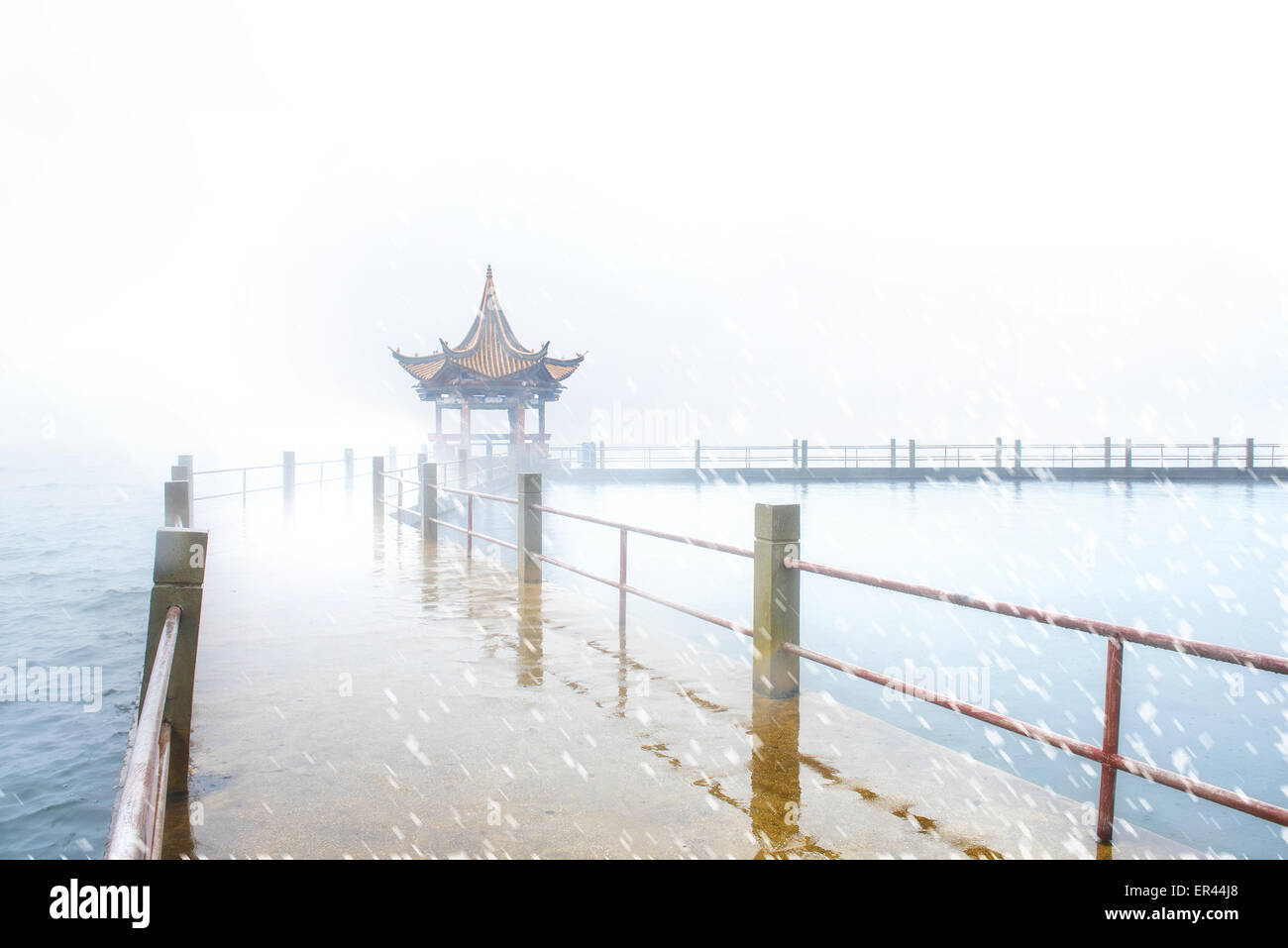 Dali, Yunnan, CHN. 10th Jan, 2015. Dali, CHINA - Jan 09 2015: (EDITORIAL USE ONLY. CHINA OUT) ï¼ˆPhoto has been processedï¼‰Erhai Lake in the rain. Erhai Lake is the largest highland lake next to Dianchi and one of the seven biggest fresh water lakes in China. ''Erhai'' means ''sea shaped like an ear'' in Chinese. Implying that the lake is ear shaped and as large as a sea, it was so named. The lake covers an area of 250 square kilometers and is located about 2 kilometers east of Dali. It is like a crescent lying between Cangshan and Dali city as seen from Cangshan Mount. In a sunny day, the c Stock Photo