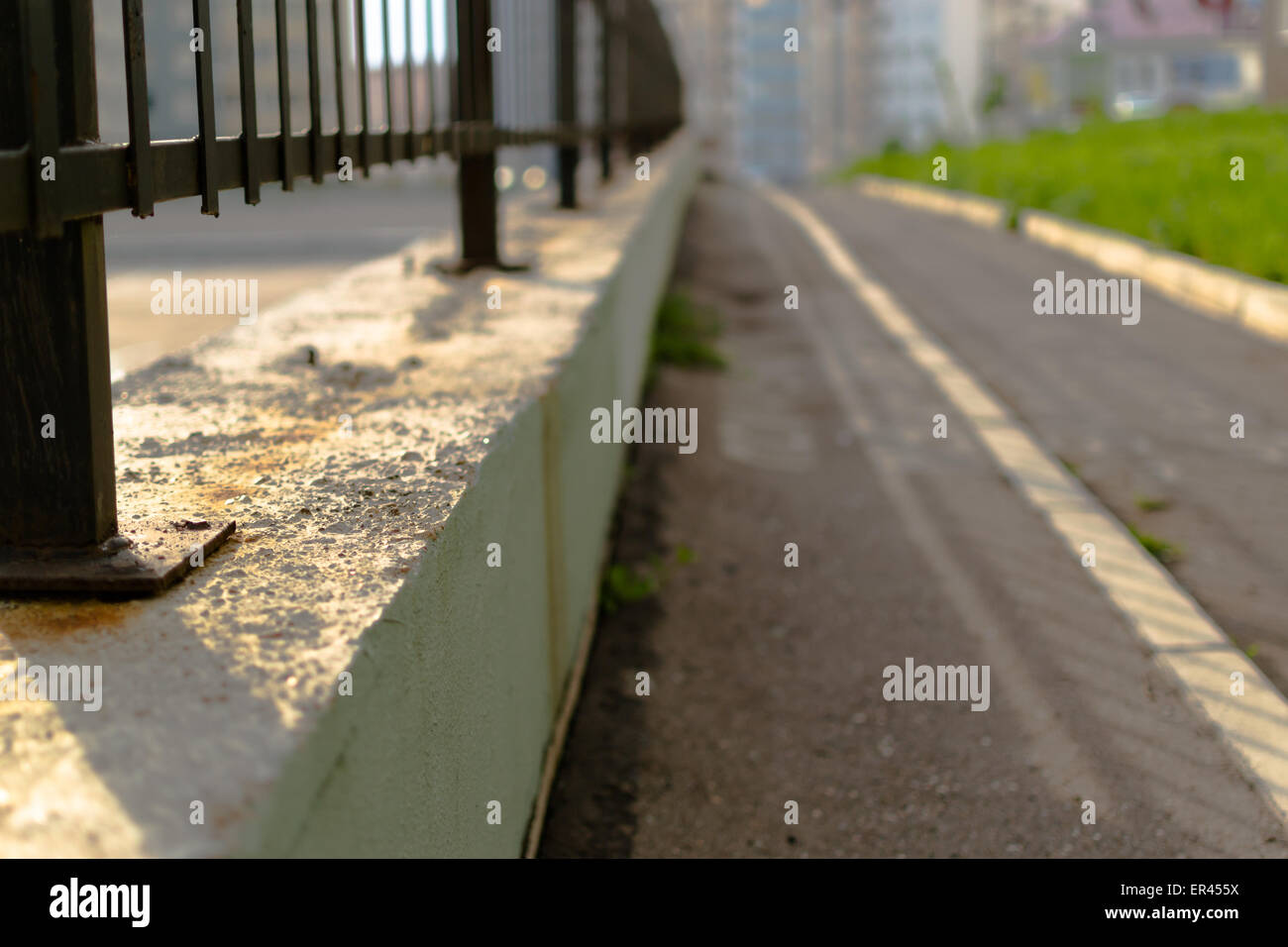 Pedestrian railings going off into the distance Stock Photo - Alamy