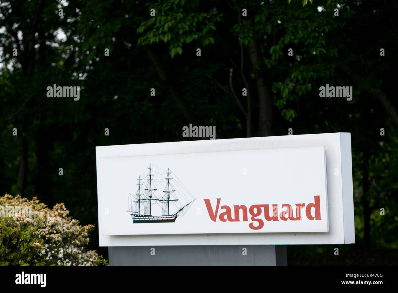 A logo sign outside of the headquarters of the investment management company, The Vanguard Group. Stock Photo