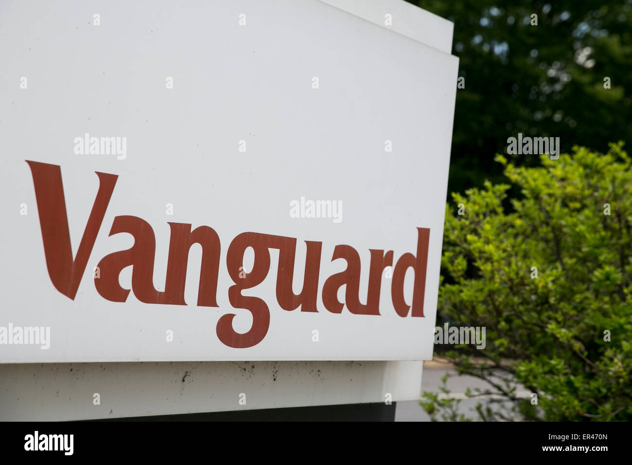 A logo sign outside of the headquarters of the investment management company, The Vanguard Group. Stock Photo