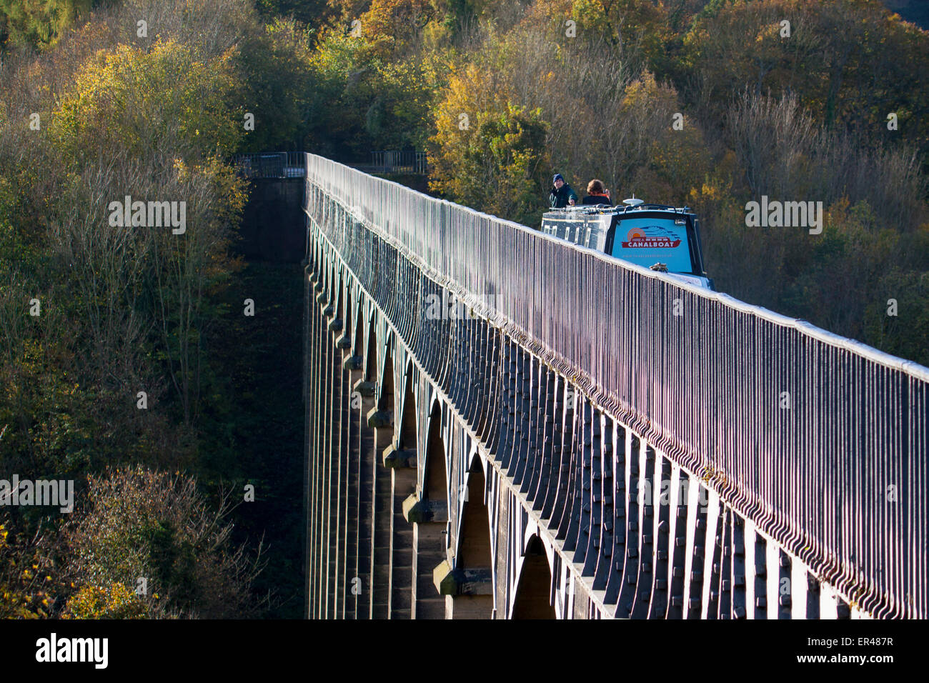 Pontcysyllte Aqueduct in autumn with canal boat crossing with couple Trevor Near Llangollen Wrexham County North East Wales UK Stock Photo