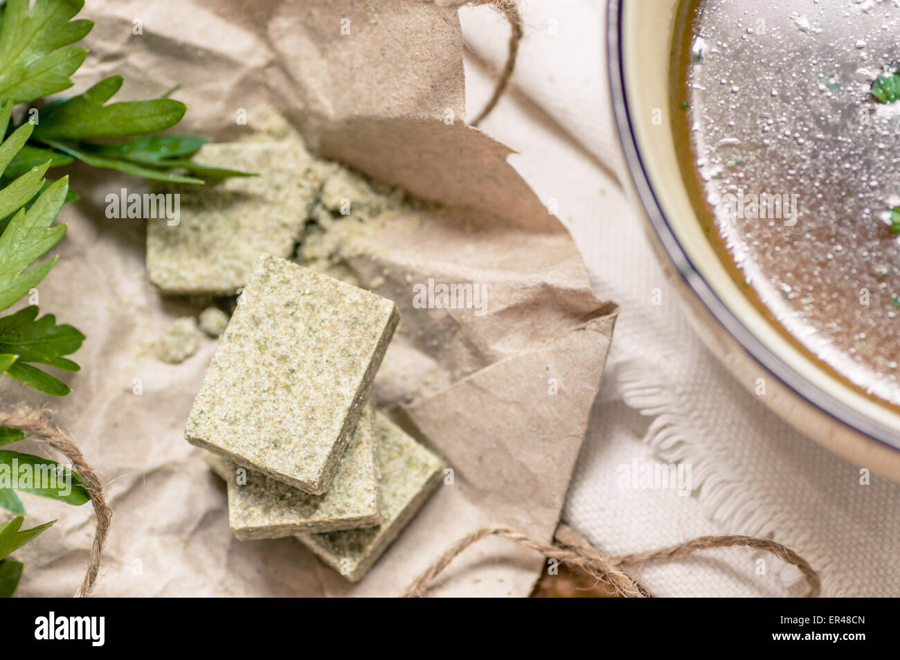 Bouillon cubes on paper a top rustic Stock Photo