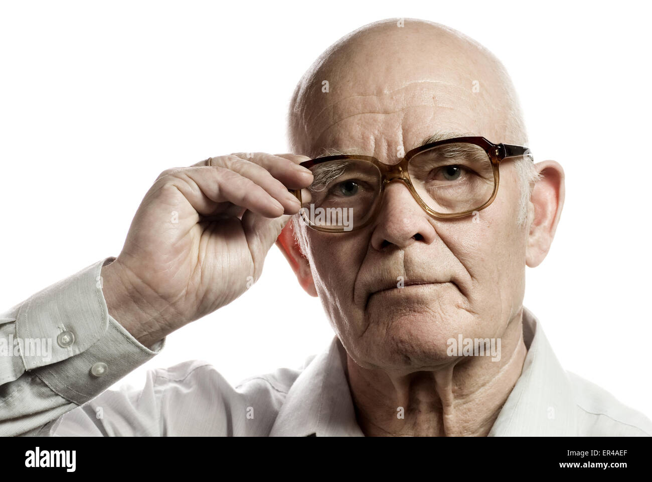 Elderly man with massive glasses isolated on white background Stock Photo