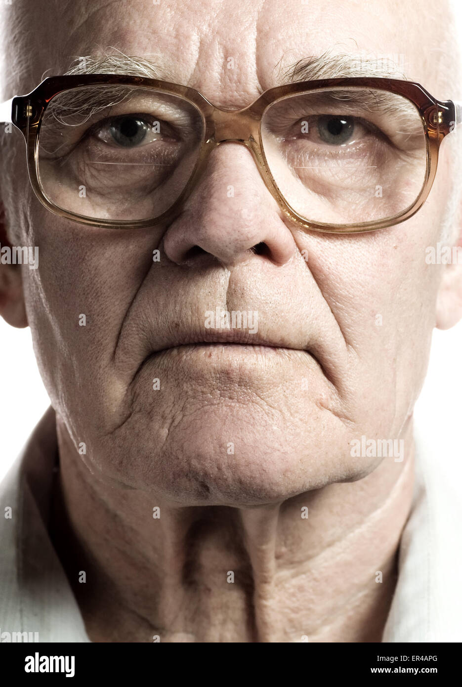 Elderly man with massive glasses Stock Photo