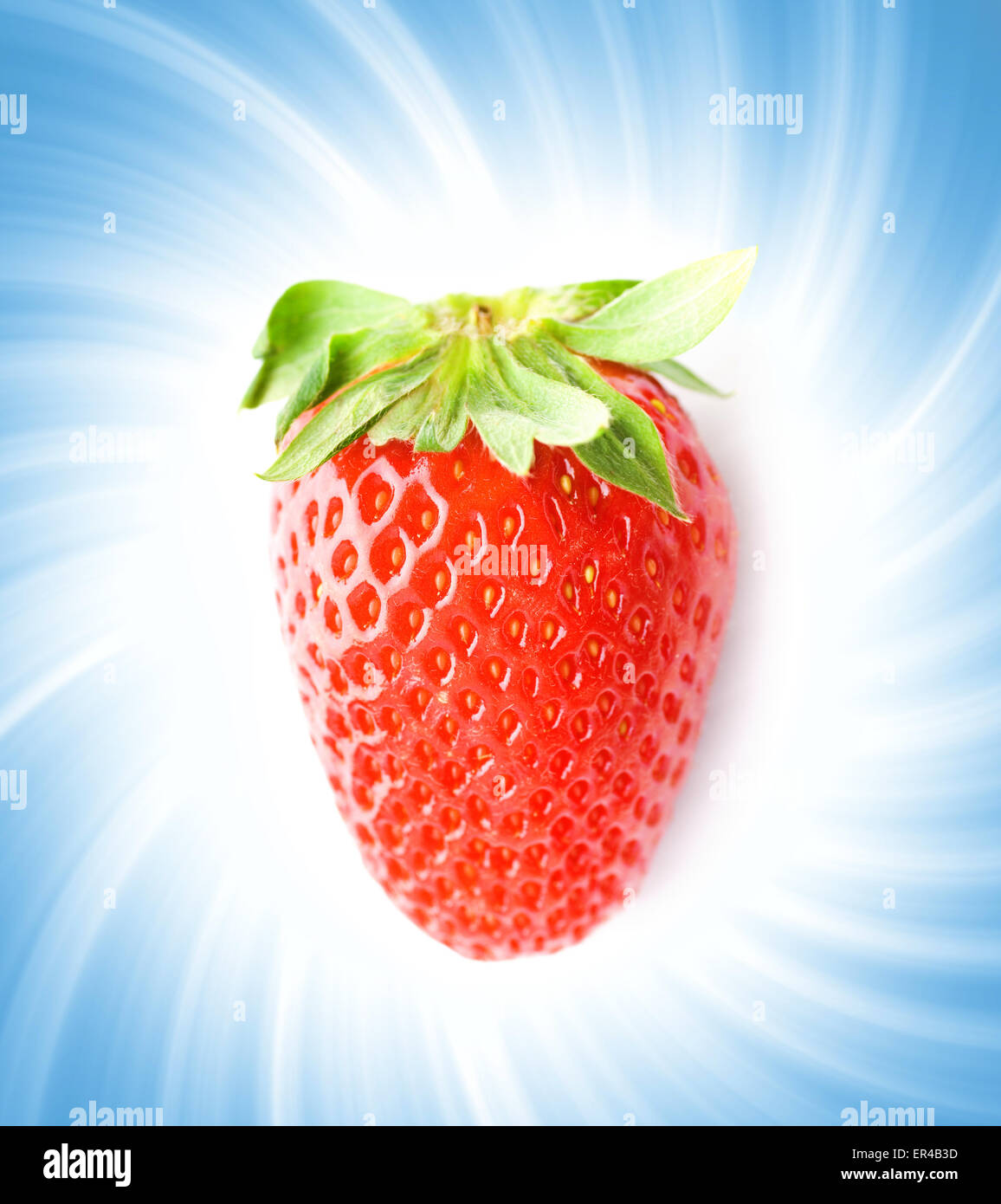 Ripe strawberry over abstract blue background Stock Photo - Alamy