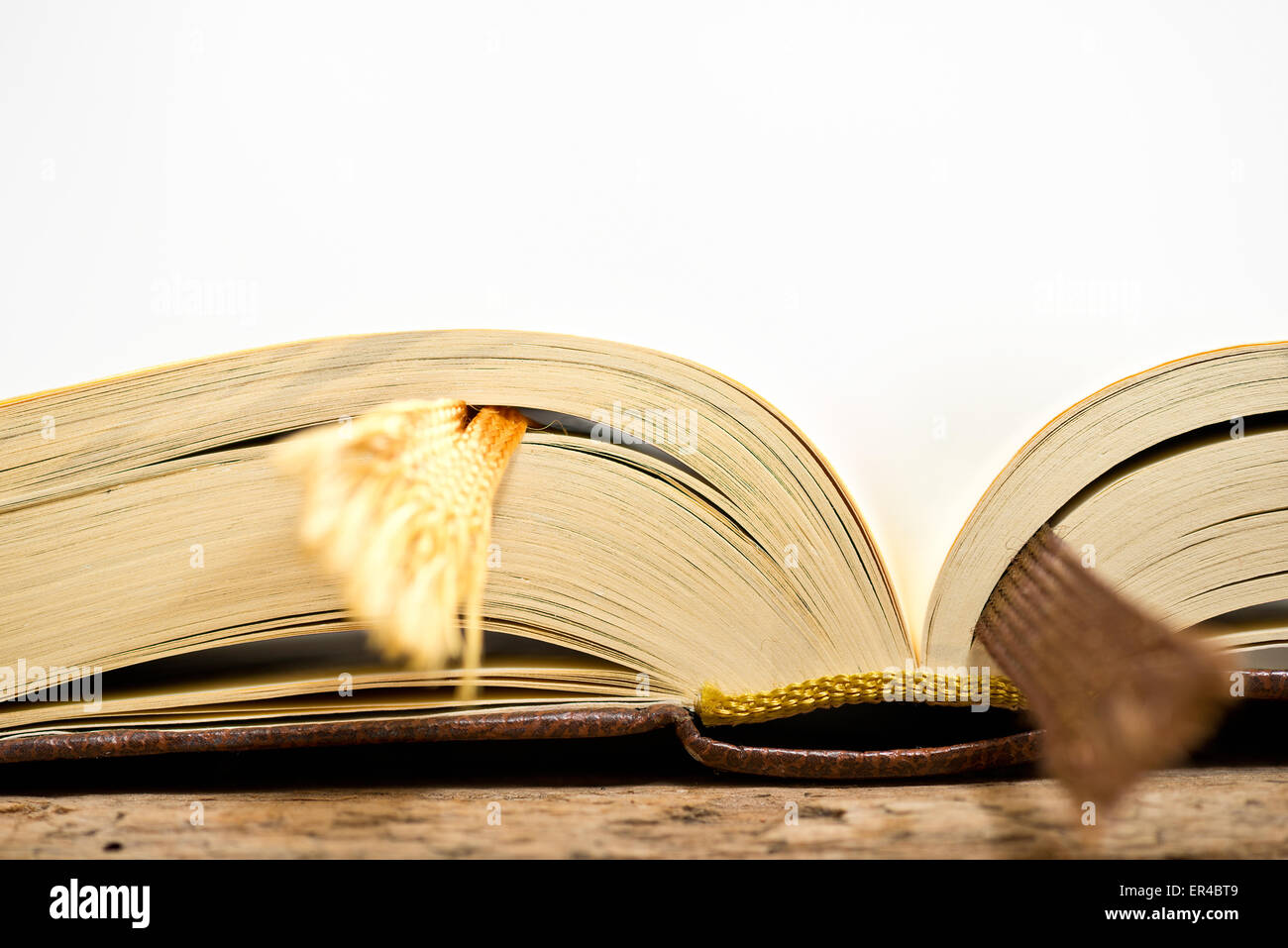detail of open book on the white background Stock Photo - Alamy