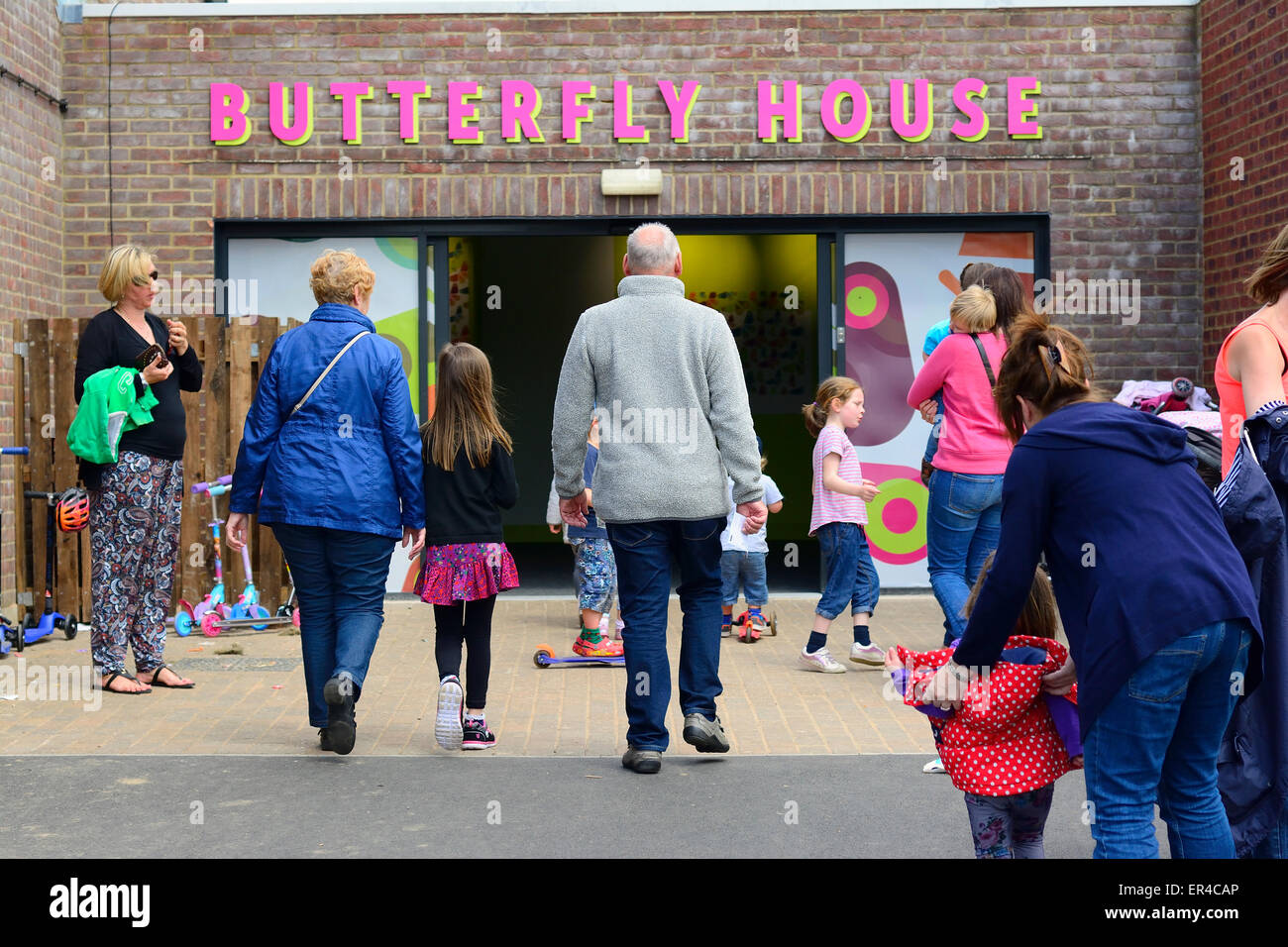 Families visiting a Butterfly House at Whipsnade Zoo, Bedfordshire