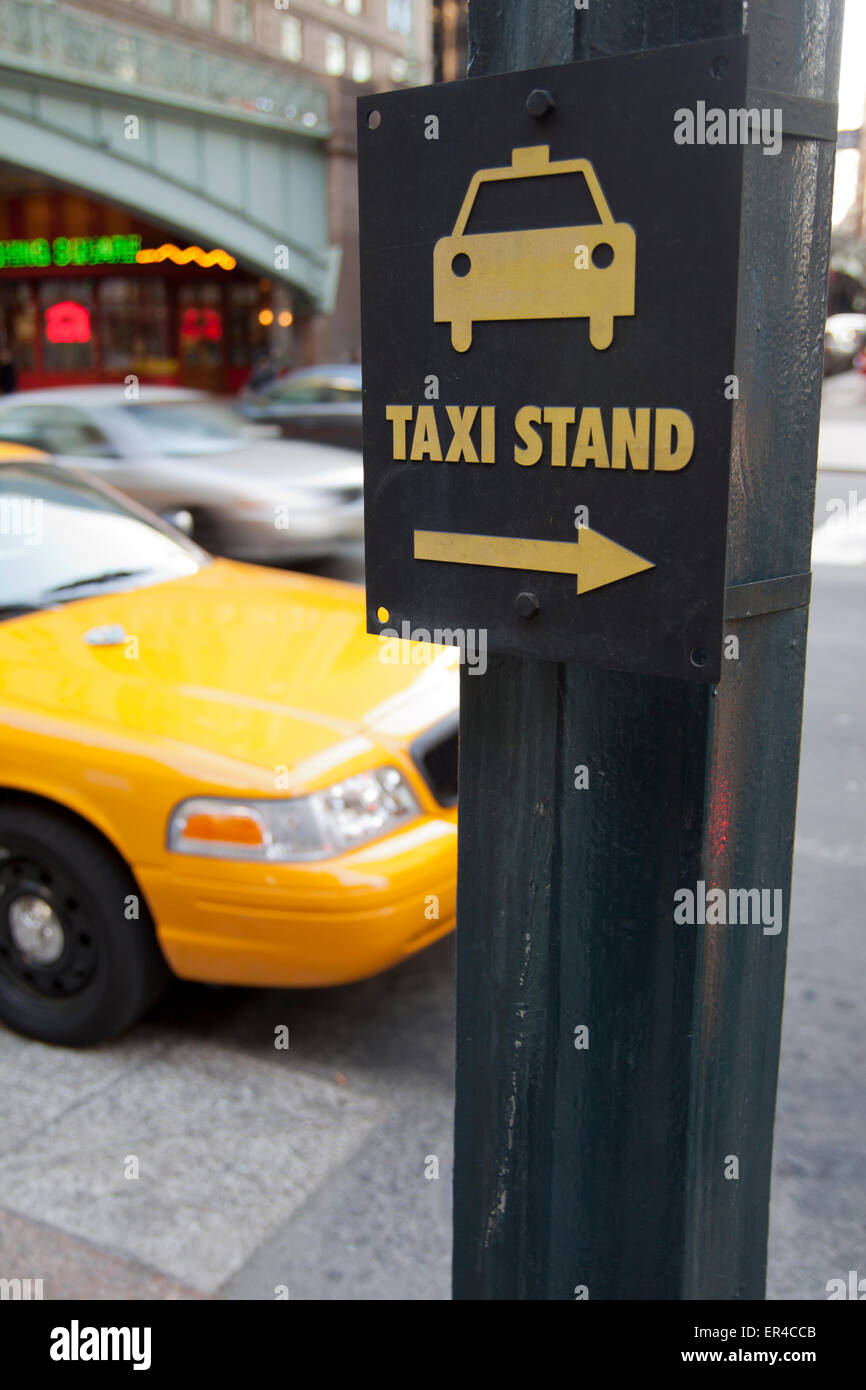 Taxi stand sign and yellow cab in New York city Stock Photo Alamy