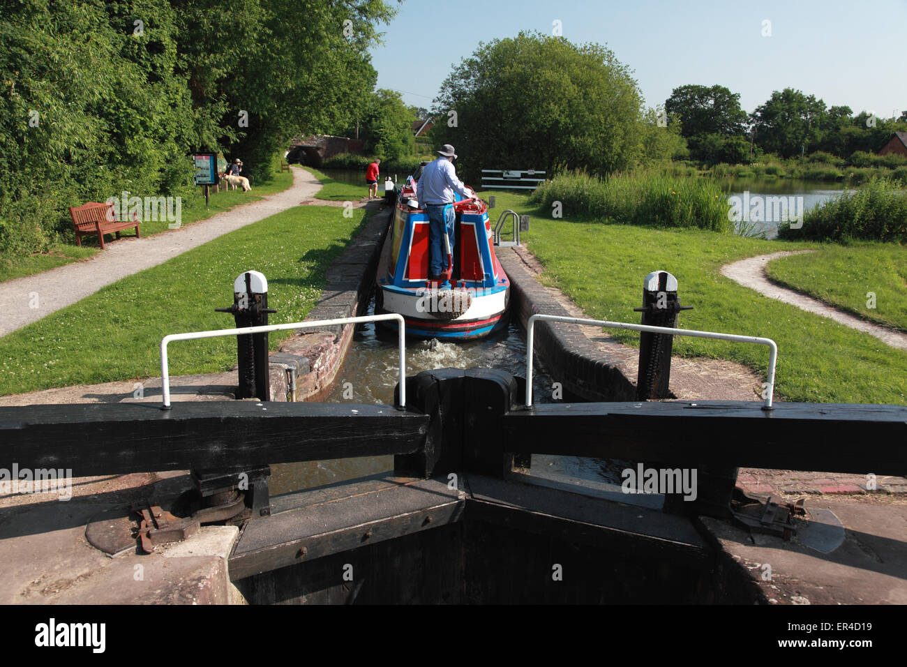 A narrowboat in Lock 19 of the Lapworth flight at Kingswood Junction on the Stratford on Avon Canal, Solihull, England Stock Photo