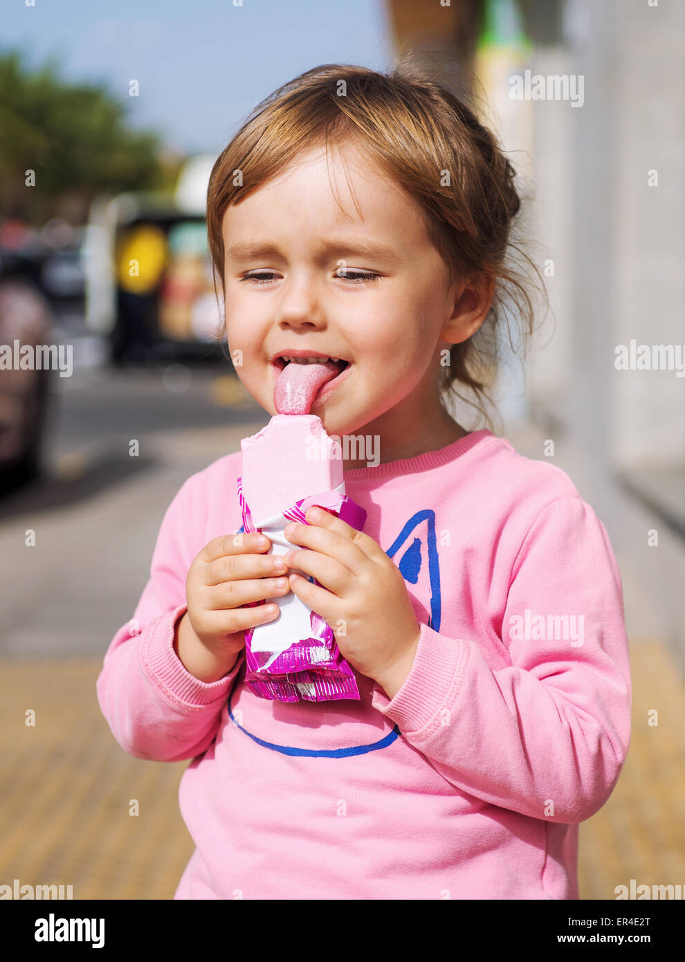 Girl licking an ice cream Stock Photo