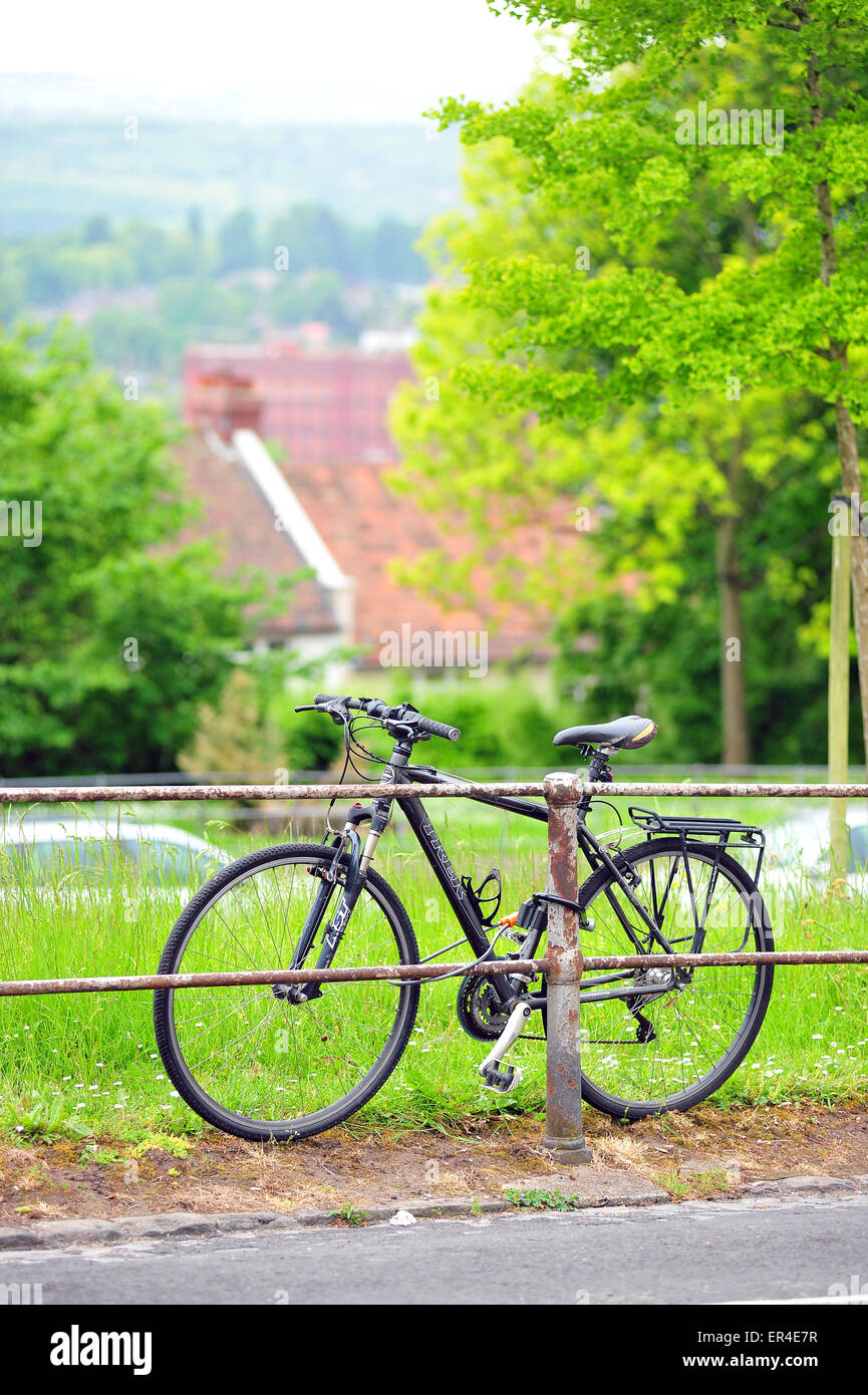 A bicycle parked to metal fencing in the Clifton area of Bristol. Stock Photo